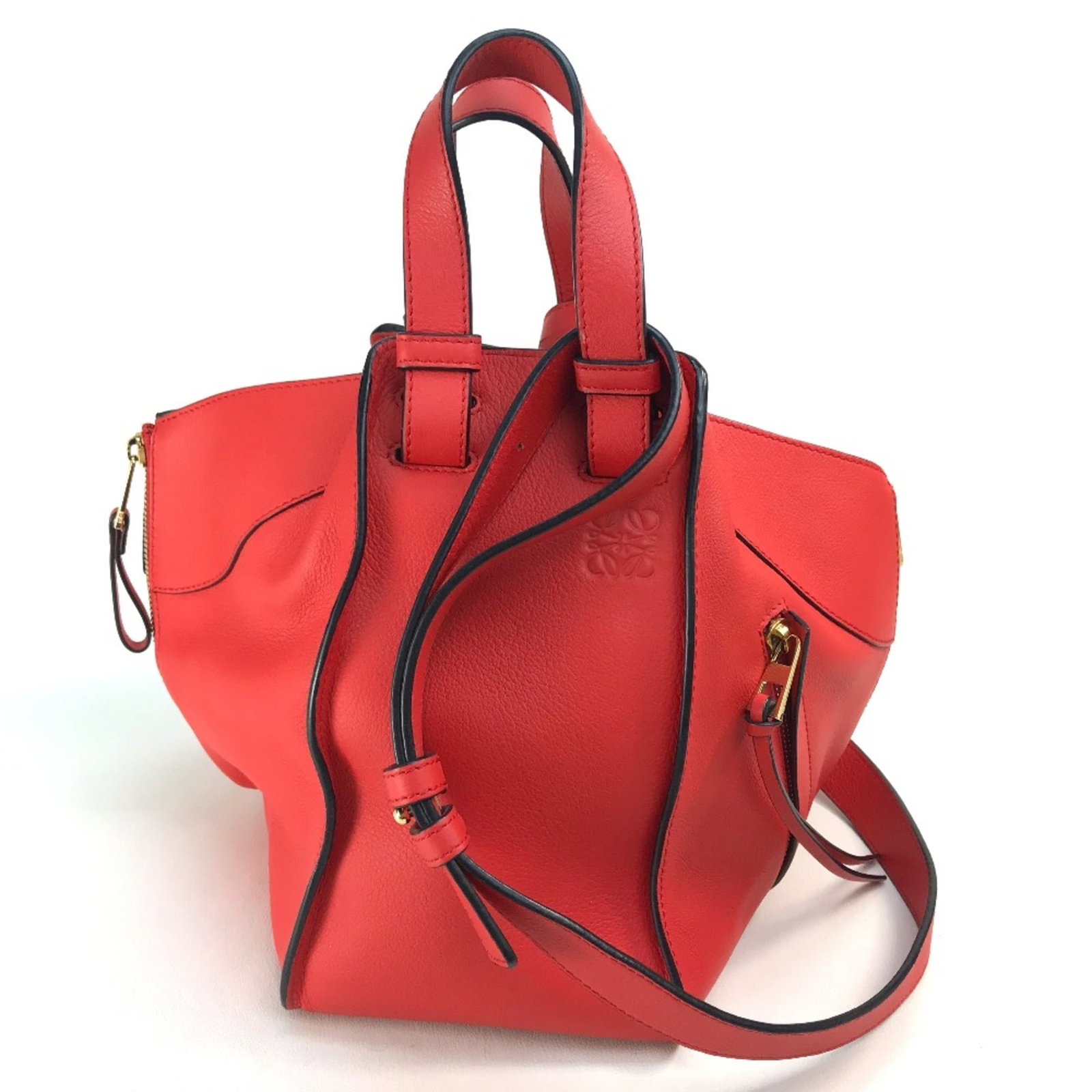 Loewe Handbag Leather: Loewe Handbag Leather Red Loewe Handbag Leather. Made from high-quality leather, this handbag measures 22cm x24cm x13.5cm and features a striking red color. With its classic design and timeless style,