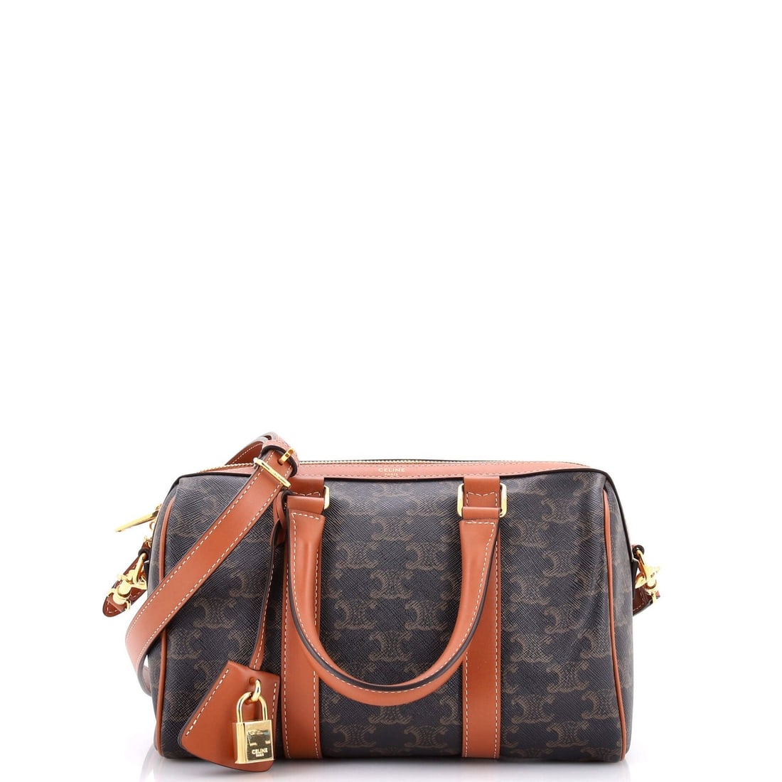 Canvas coated bag Celine medium Boston triomphe: Canvas coated bag Celine medium Boston triomphe Canvas coated bag Celine medium Boston triomphe, featuring a classic brown exterior with minor creases and scuffs. The bag boasts gold hardware and a