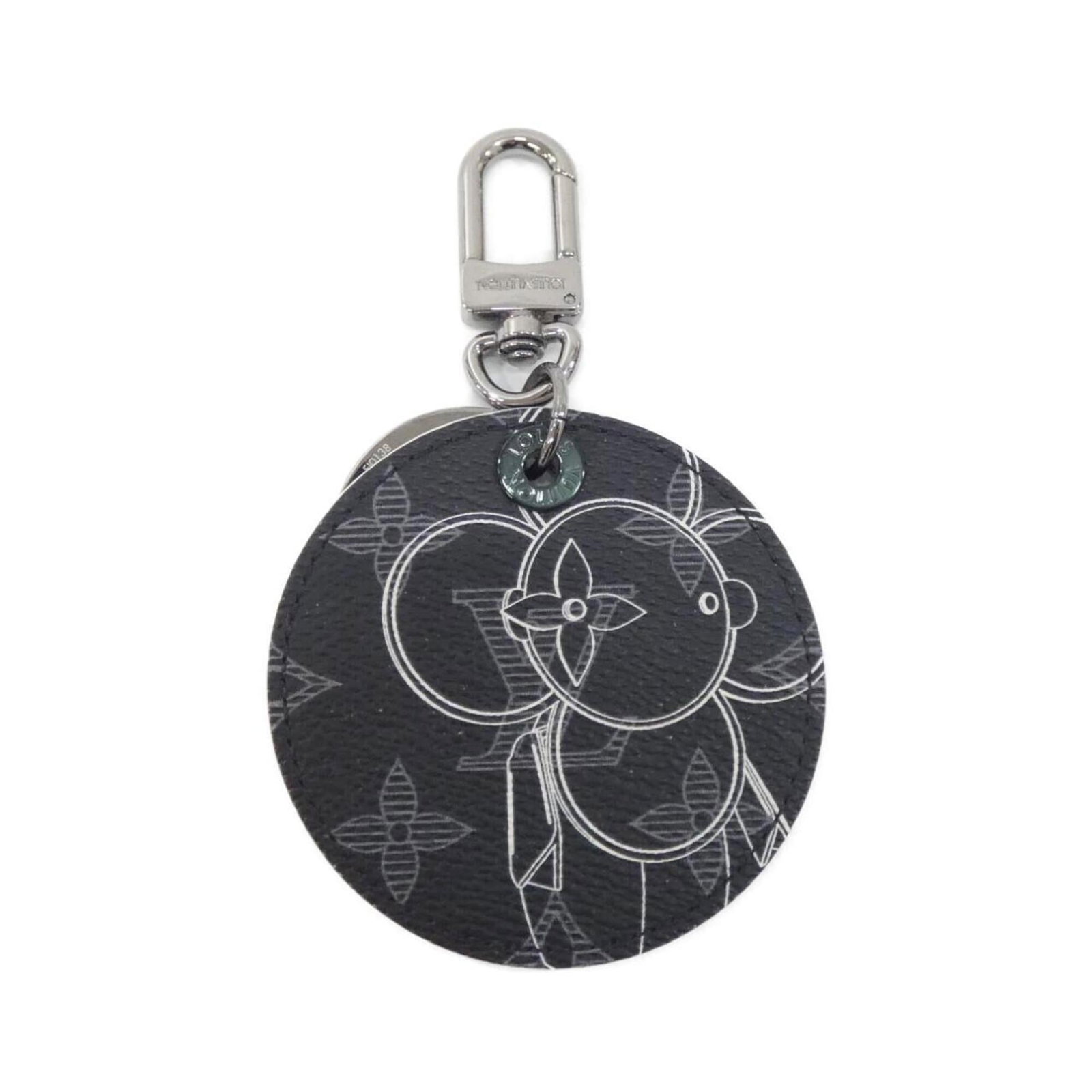 Keyring Canvas from Louis Vuitton: Keyring Canvas from Louis Vuitton Canvas keyring from Louis Vuitton, made from high-quality canvas material in black. This stylish accessory features the iconic MP1993 design, a classic and timeless p