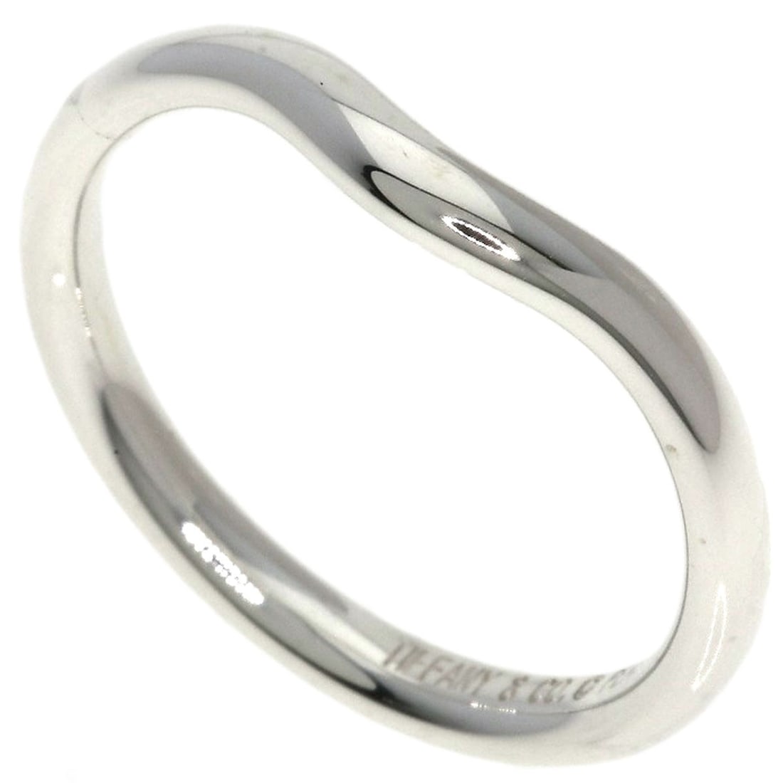 Silver Curve Ring from Tiffany & Co: Silver Curve Ring from Tiffany & Co Silver Curve Ring from Tiffany & Co features a sleek silver design with no stone. This ring boasts a classic style and a simple yet elegant aesthetic, making it a
