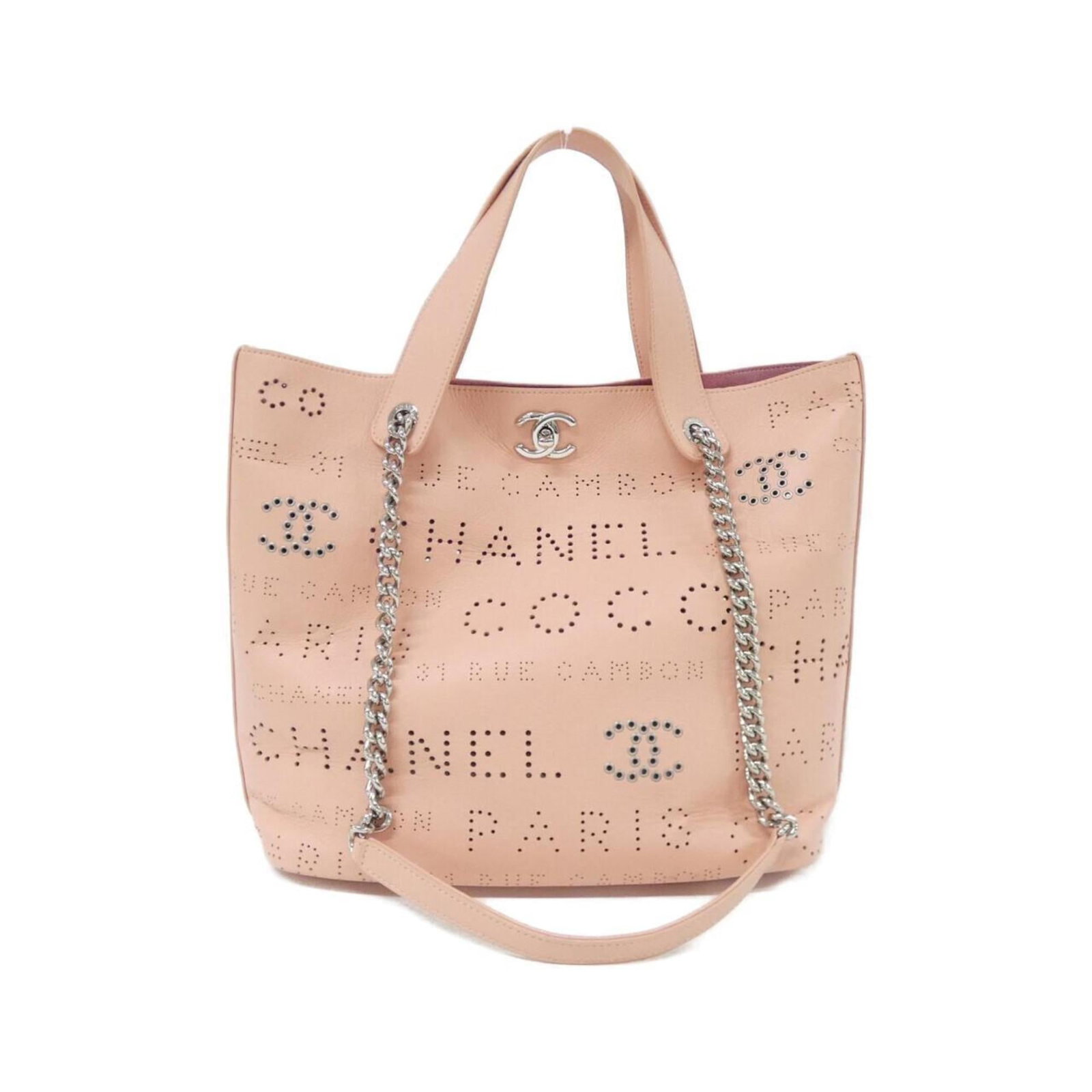 Tweed leather handbag by Chanel: Tweed leather handbag by Chanel Tweed leather handbag by Chanel features a unique pink color and silver hardware, showcasing the brand's signature style. Crafted from high-quality calfskin, this bag