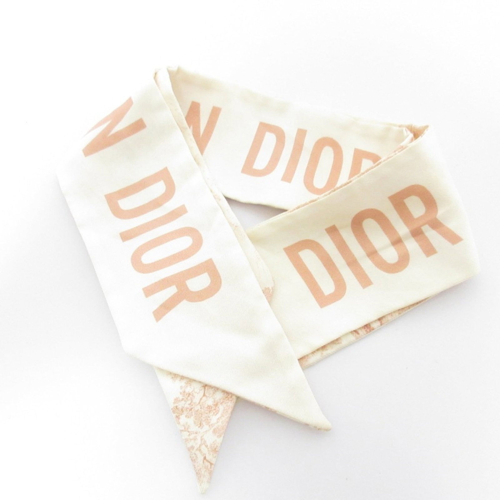 Silk by Christian Dior Scarf: Silk by Christian Dior Scarf Silk by Christian Dior Scarf features a classic design in beige and pink hues, crafted from high-quality silk material. The scarf measures 6.3cm x 1.05m, making it a