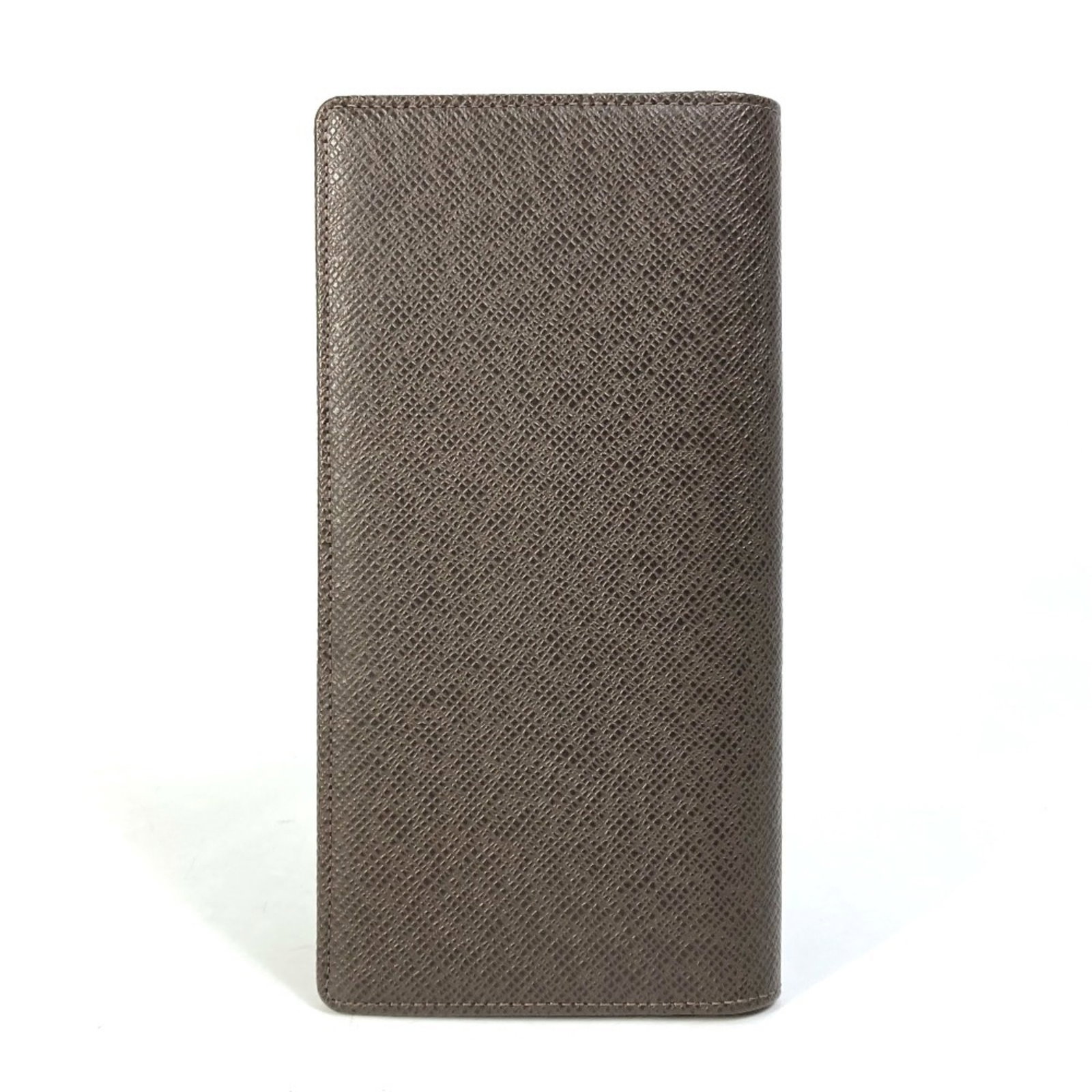 Long wallet bill Louis Vuitton Taiga leather bi-fold: Long wallet bill Louis Vuitton Taiga leather bi-fold The Louis Vuitton Taiga leather bi-fold wallet boasts classic design with a long bill, perfectly sized for everyday use. Made from high-quality