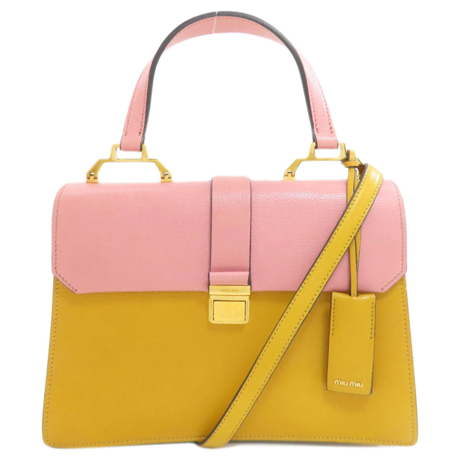 Handbag Leather Miu: Handbag Leather Miu Pink and Yellow Miu Miu Leather Handbag. This vibrant handbag features a magnet closure, zipper pocket on the outer side, and an inner zipper pocket for added organization. Its spa
