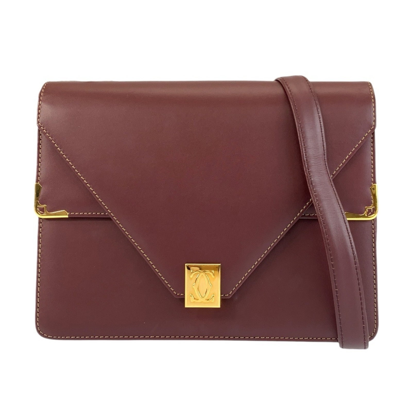 Shoulder Bag Leather Pochette Cartier: Shoulder Bag Leather Pochette Cartier Bordeaux leather, a classic Cartier design, and French craftsmanship come together in this elegant pochette. Measuring 19cm x 24cm x 3cm, it's the perfect size