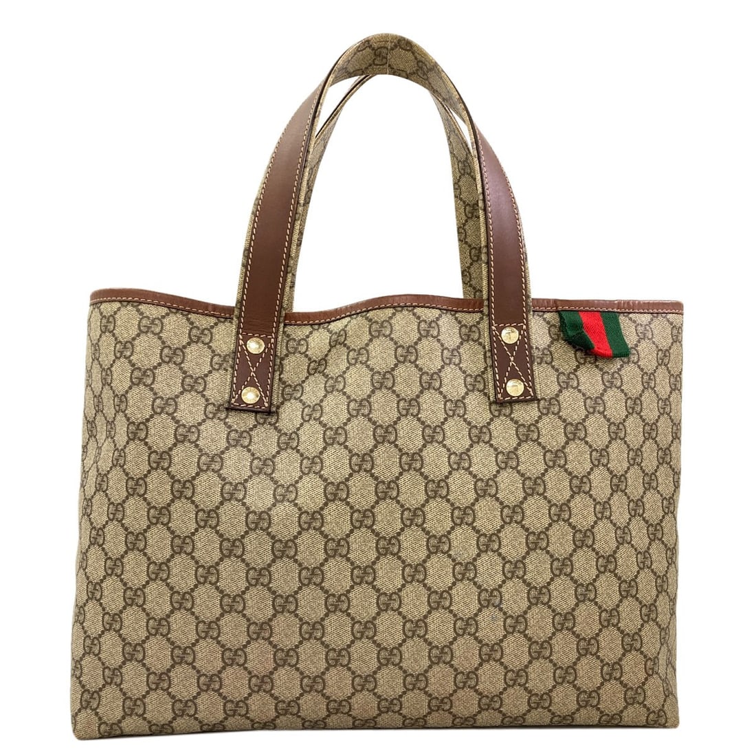 Gucci 211134 Gg Supreme Tote Bag Pvc: Gucci 211134 Gg Supreme Tote Bag Pvc Gucci's iconic Supreme Tote Bag features a striking brown PVC exterior, making it a standout in any setting. The bag's bold design and durable material make it a p