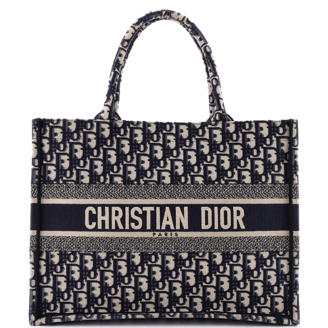 Christian Dior Book Oblique Medium Canvas Tote: Christian Dior Book Oblique Medium Canvas Tote The Christian Dior Book Oblique Medium Canvas Tote boasts a striking blue exterior with minor creases, corner wear, and discoloration. This excellent