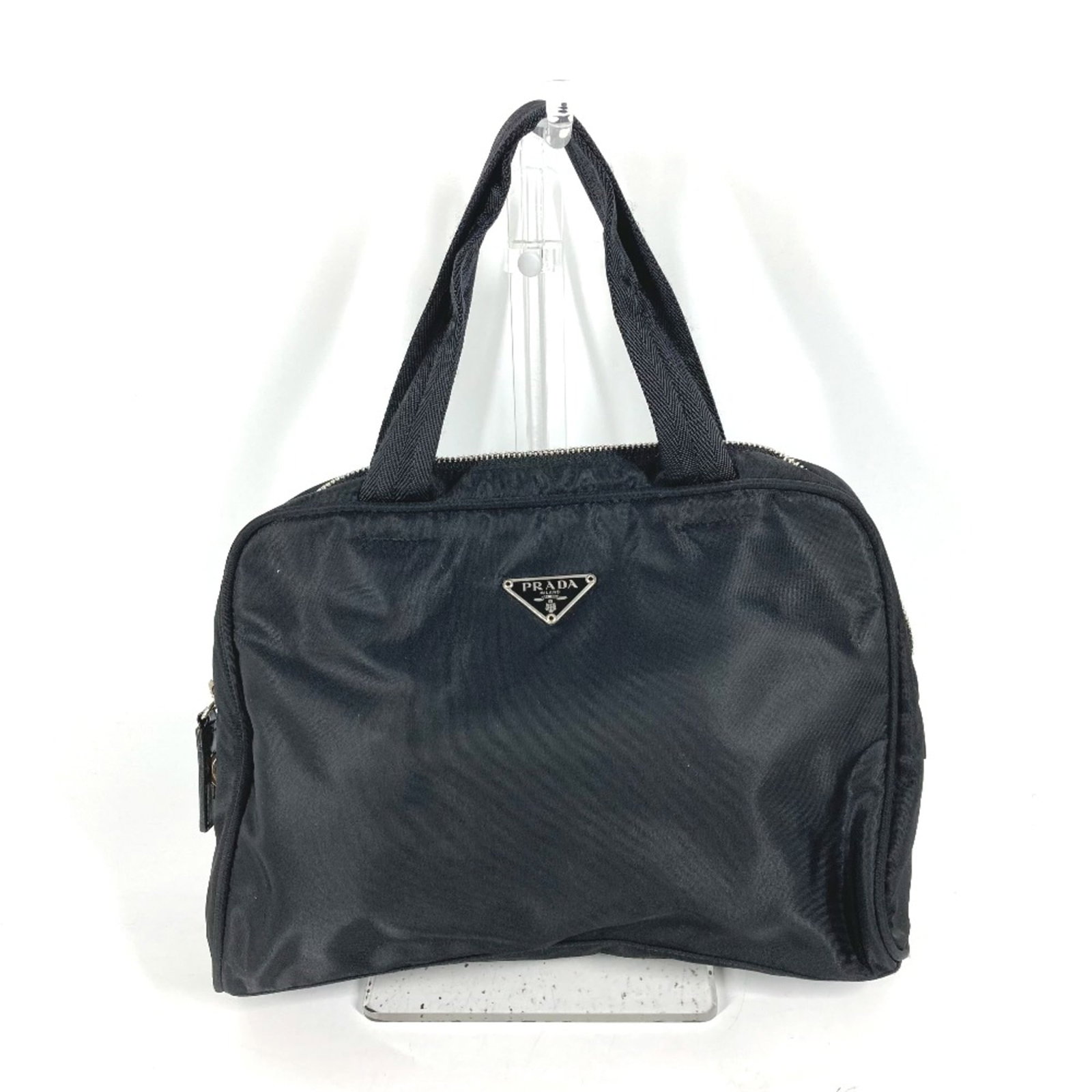 Prada Handbag Cloth: Prada Handbag Cloth Black Prada handbag cloth with dimensions 19cm x27.5cm x9.5cm, measuring 7.5 x10.8 x3.7 inches. This cloth features the iconic design and style of the luxury brand, Prada. Item Spe