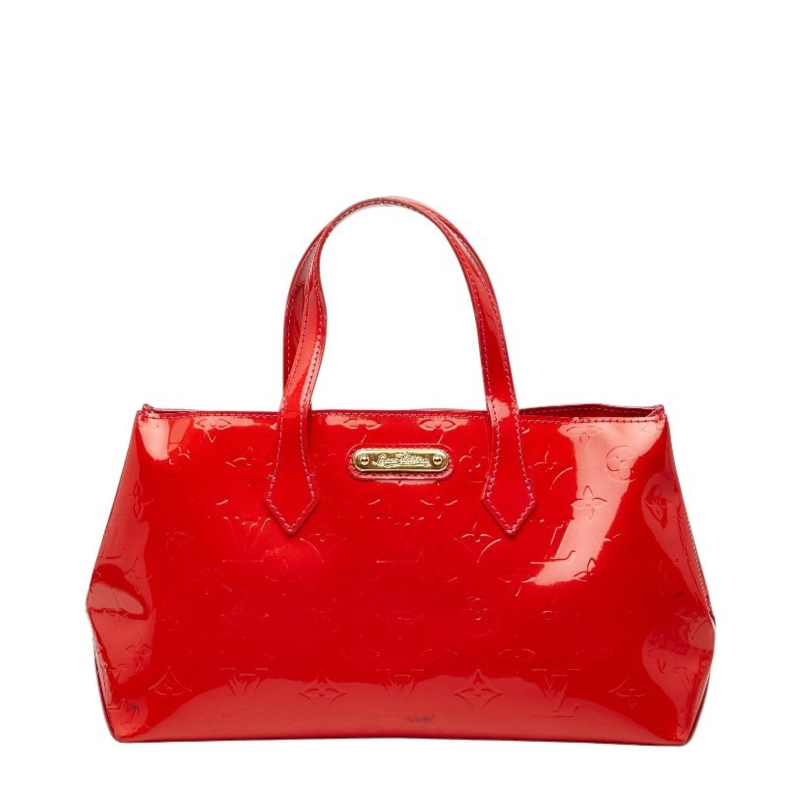 Patent Leather Louis Vuitton Handbag: Patent Leather Louis Vuitton Handbag Patent leather Louis Vuitton handbag in the iconic Pomme d'amour red color, featuring a classic design with clean lines and a timeless aesthetic. Made from