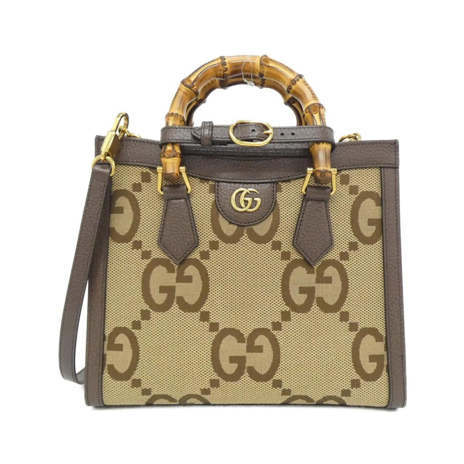 Gucci Handbag Gg Canvas Leather: Gucci Handbag Gg Canvas Leather Gucci's iconic GG Canvas Leather handbag boasts a timeless brown and camel color combination, complemented by gold hardware accents. This stylish bag features a sturdy 