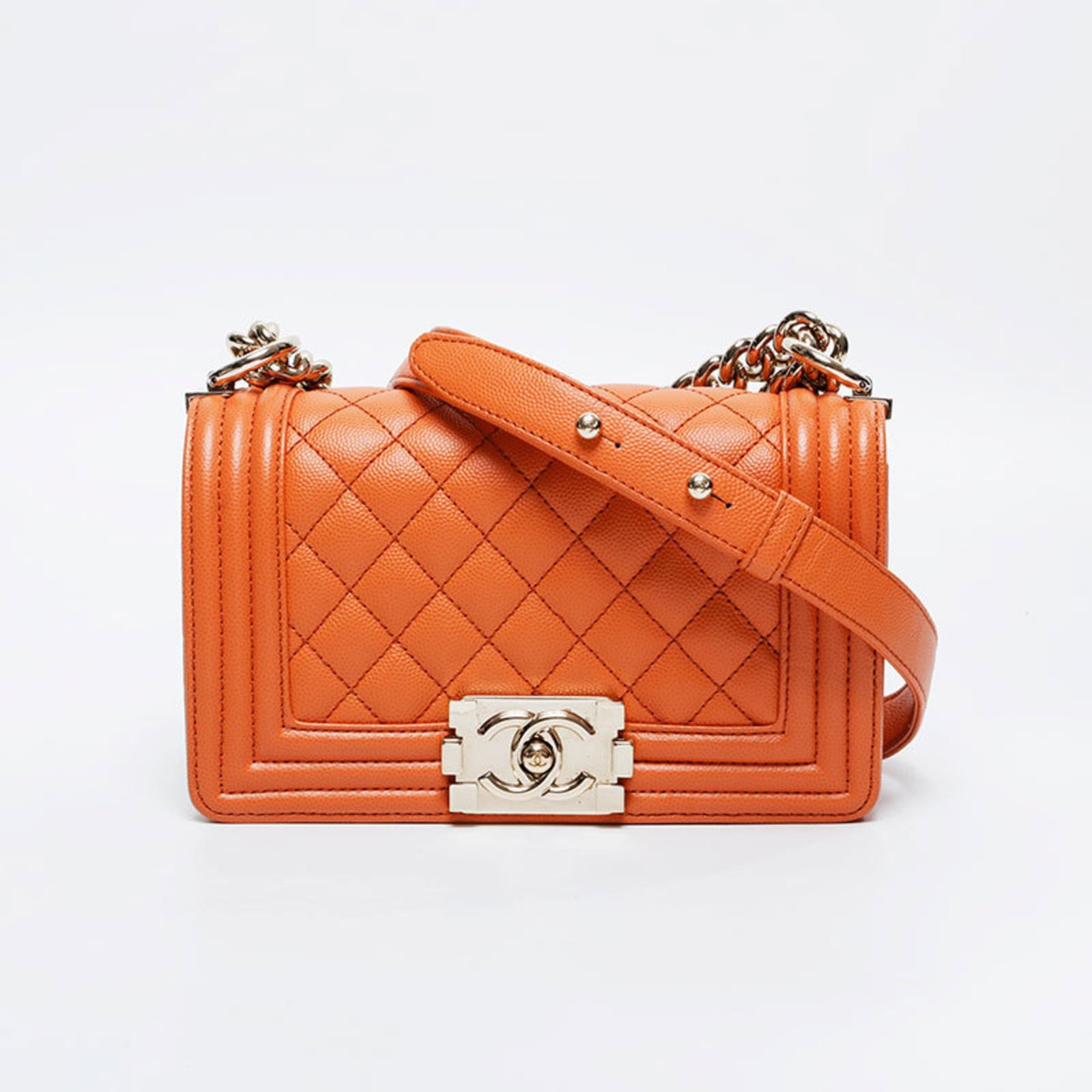 Shoulder Bag by Chanel: Shoulder Bag by Chanel Orange shoulder bag by Chanel, measuring 11cm x 20cm x 5.5cm from France. This vibrant orange color adds a pop of personality to any outfit. A stylish and compact design makes i