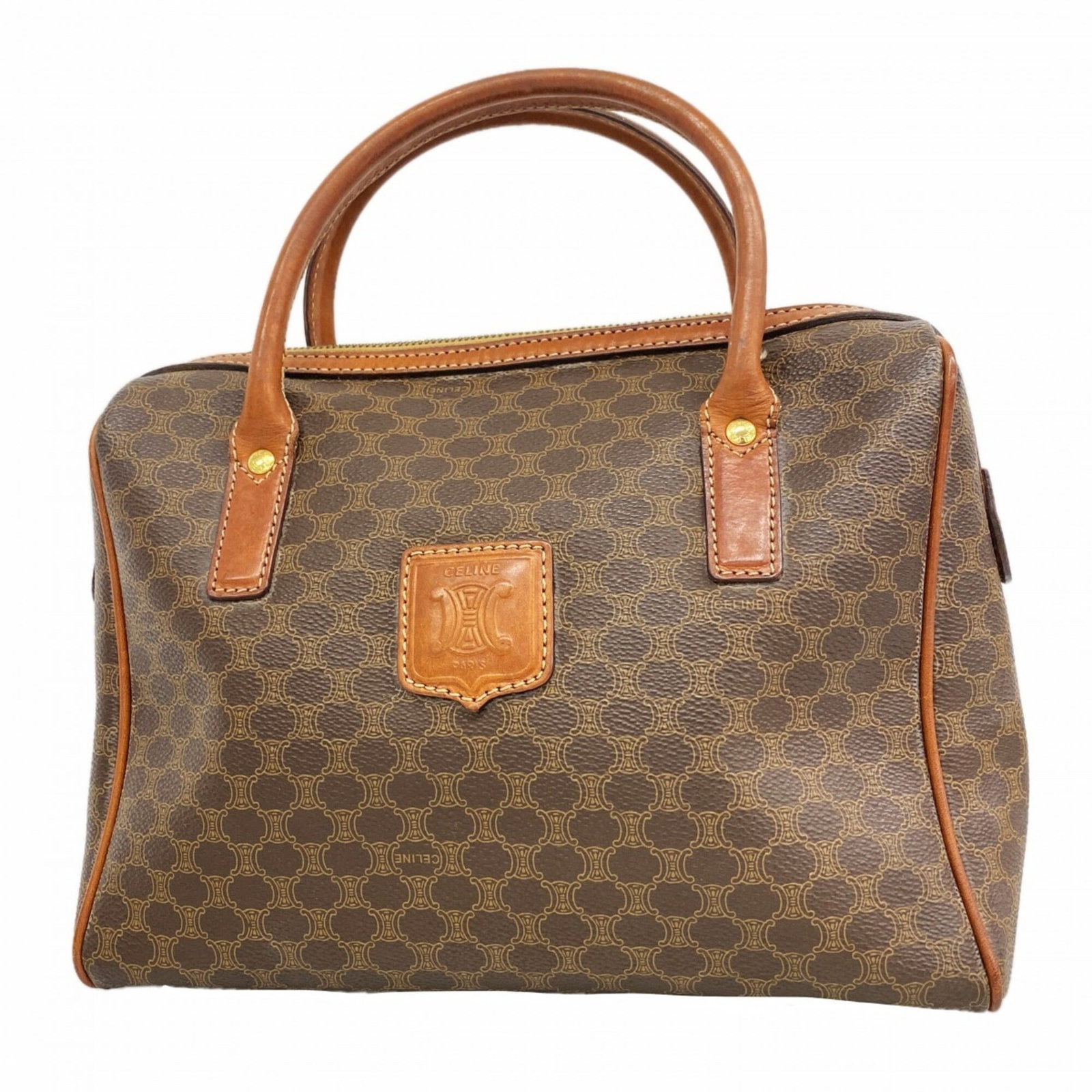 Handbag of PVC by Celine: Handbag of PVC by Celine The Celine PVC handbag boasts a sleek, brown finish and gold hardware, making for a stylish accessory. Measuring 19cm x 26cm x 11cm, this compact bag is designed to be both fu