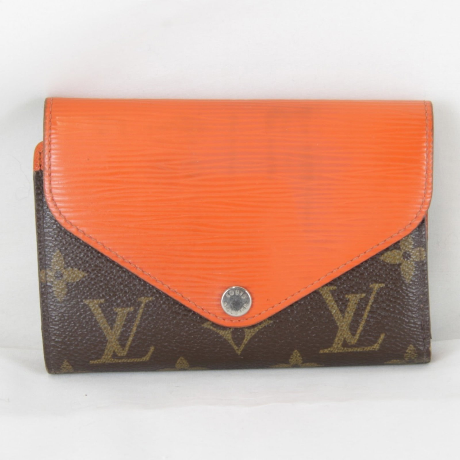 Louis Vuitton Wallet (Tri-Fold) Monogram Epi Leather: Louis Vuitton Wallet (Tri-Fold) Monogram Epi Leather Monogram Epi leather adds a touch of sophistication to the classic tri-fold design, while the iconic brown and orange color combination gives it a