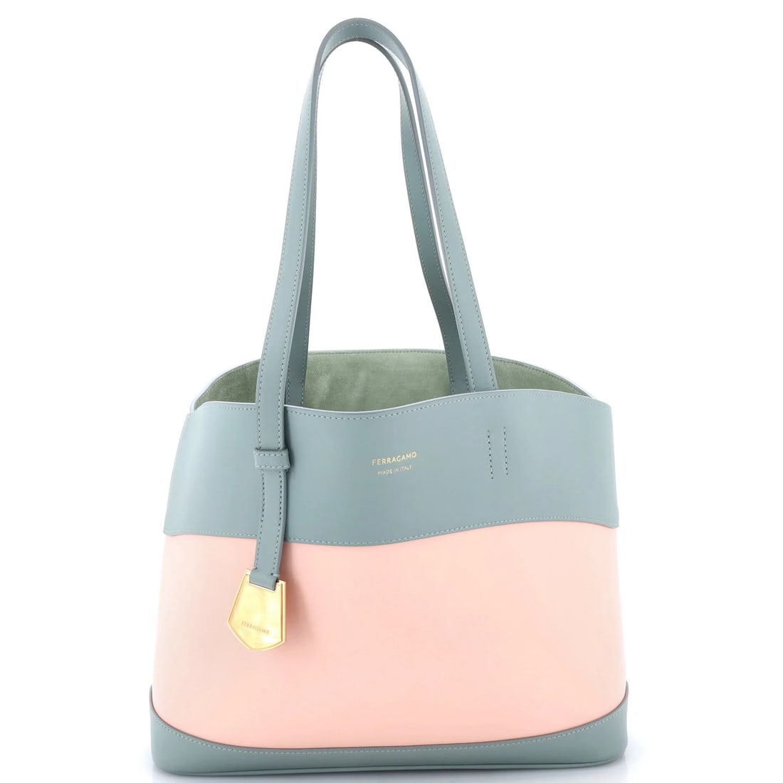 Small leather charming tote by Salvatore Ferragamo: Small leather charming tote by Salvatore Ferragamo Small leather charming tote by Salvatore Ferragamo, featuring pink exterior with suede blue interior and gold hardware. Measuring 11.5" wide and 9"