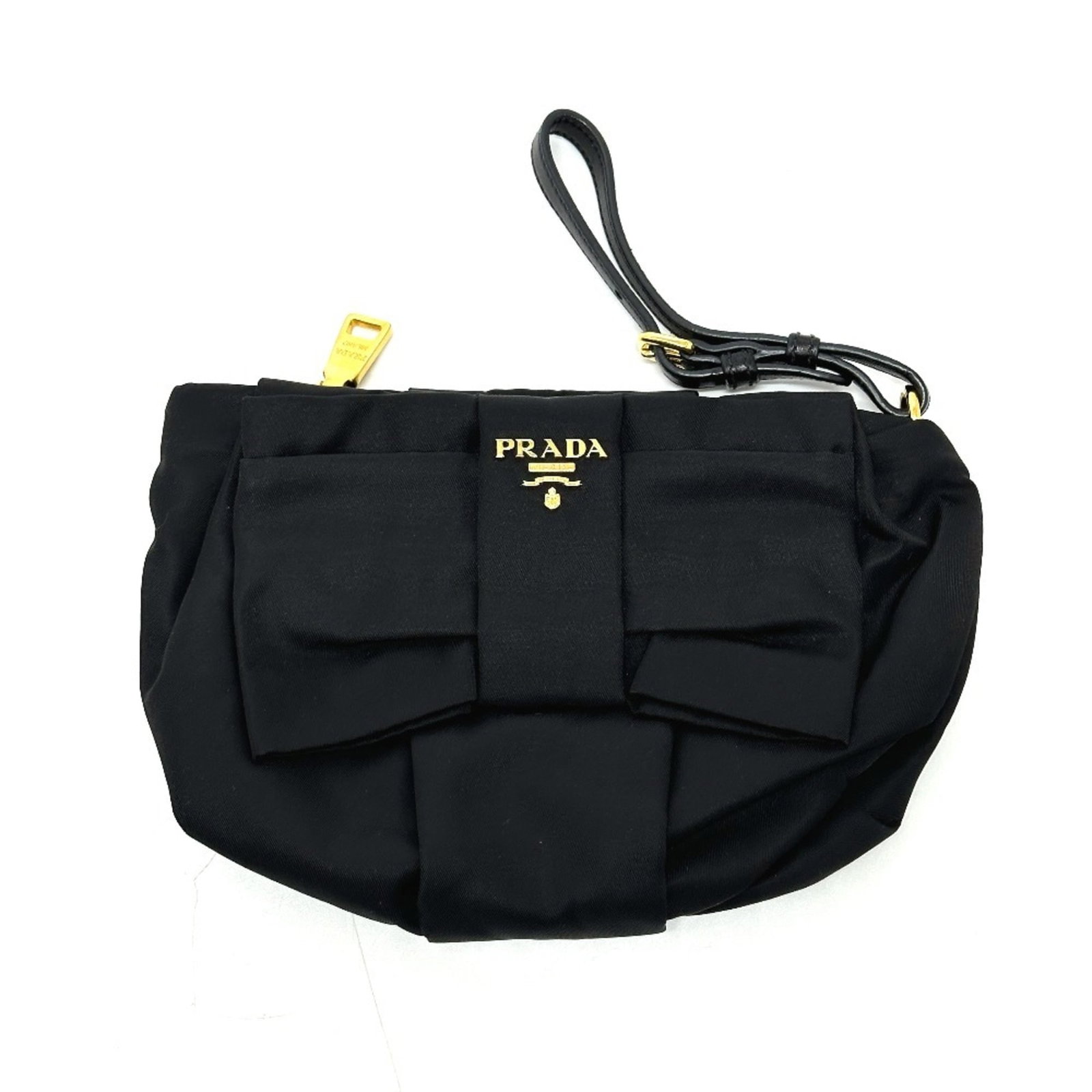 Leather Nylon Pouch Prada: Leather Nylon Pouch Prada Prada's Leather Nylon Pouch features a sleek black design with a zipper closure. The durable combination of leather and nylon provides a stylish and practical accessory for e