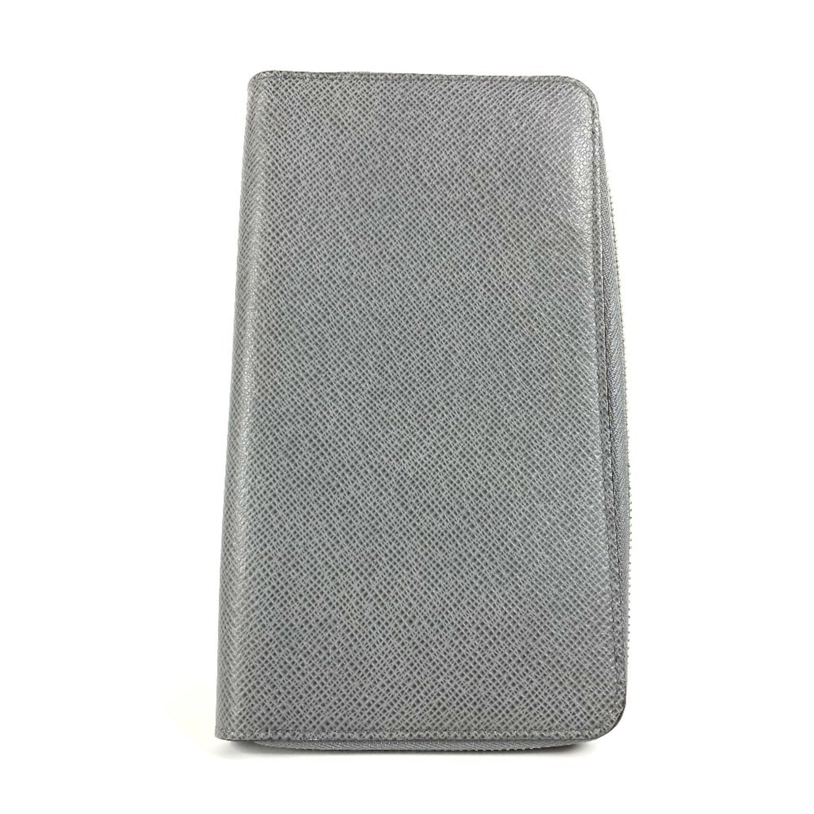 Long Wallet Bi Fold Leather Taiga Louis Vuitton: Long Wallet Bi Fold Leather Taiga Louis Vuitton Taiga leather gives this bi-fold wallet its distinctive texture and depth, while the Glacier color adds a subtle touch of sophistication. Measuring
