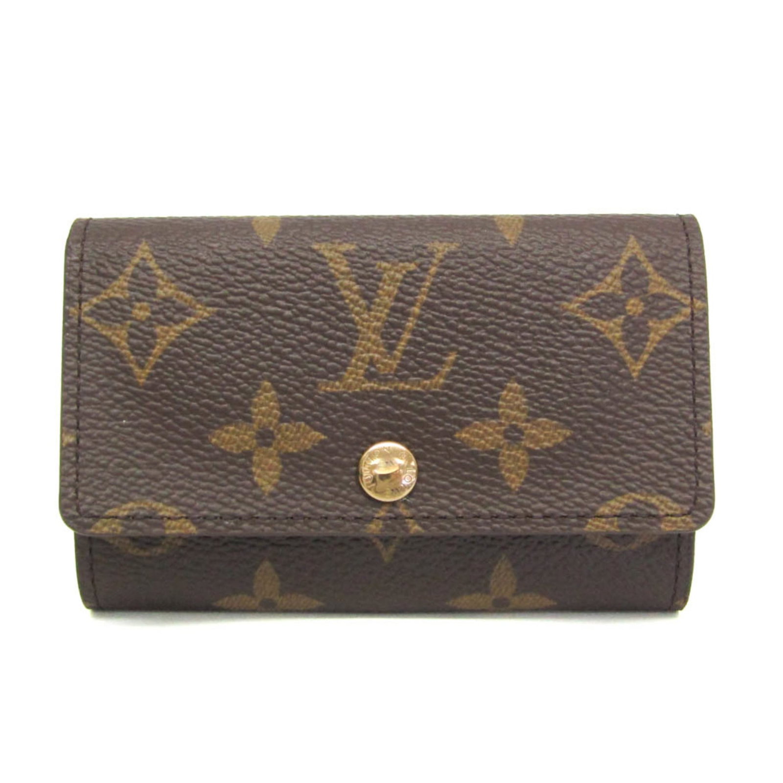Vuitton Louis Keycase Monogram: Vuitton Louis Keycase Monogram The iconic Louis Vuitton Monogram Keycase, crafted in rich brown leather with the signature interlocking M pattern. This functional key holder features six secure hooks