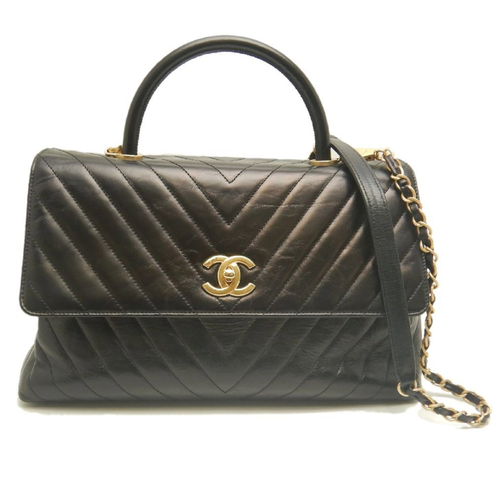 Leather Handbag Chanel: Leather Handbag Chanel Black leather handbag with gold hardware, featuring a turn lock closure and measuring 19cm x 33cm x 12cm. This stylish bag boasts a classic design and premium materials, making 