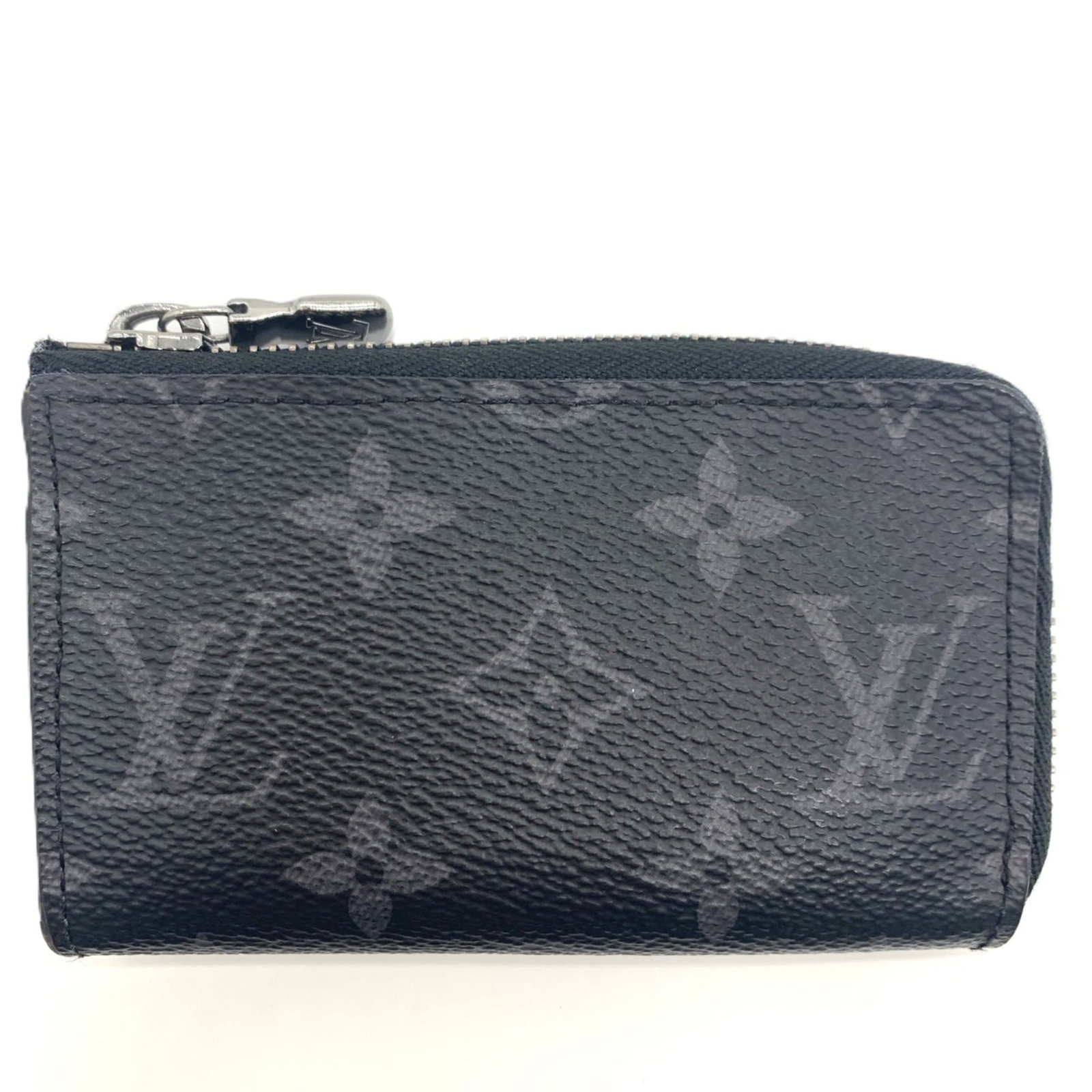 Keycase by Louis Vuitton: Keycase by Louis Vuitton Monogram Eclipse Keycase by Louis Vuitton, featuring the iconic monogram pattern in a sleek and compact design. Made with precision craftsmanship, this keycase measures 6.5cm 
