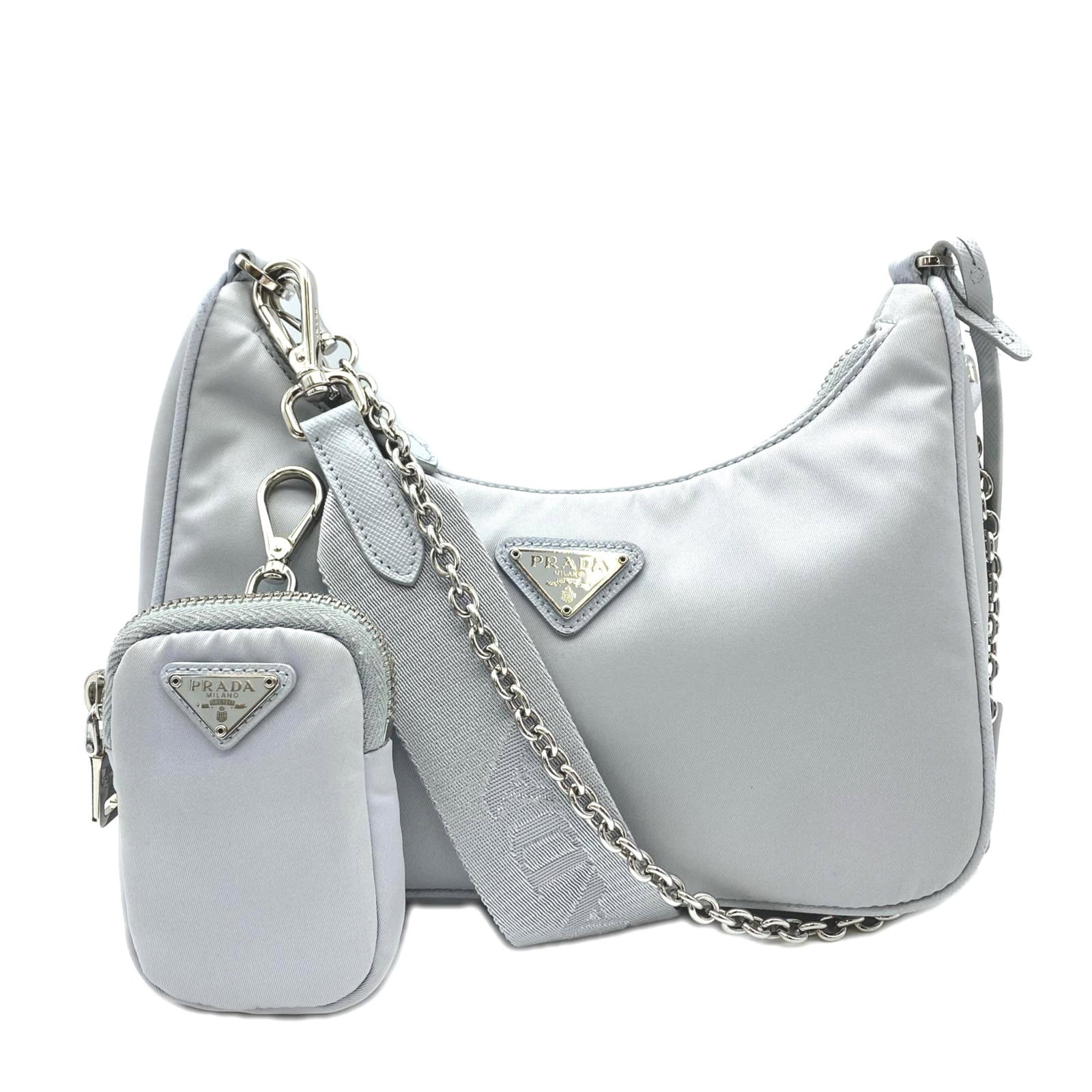 Shoulder Bag Nylon Prada: Shoulder Bag Nylon Prada This Prada shoulder bag features a sleek, gray nylon design with a sturdy zipper closure. Measuring 12cm x 22cm x 6cm, it has a comfortable strap length of 110cm, making it