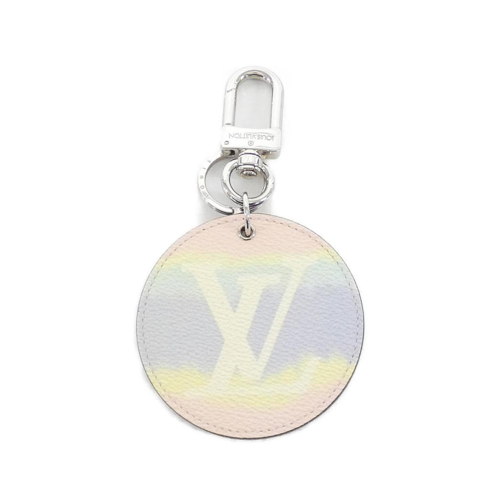 Keyring Canvas from Louis Vuitton: Keyring Canvas from Louis Vuitton Canvas keyring from Louis Vuitton, featuring a multi-color design. Made from canvas material, this keyring showcases the iconic brand's signature style. A unique acce