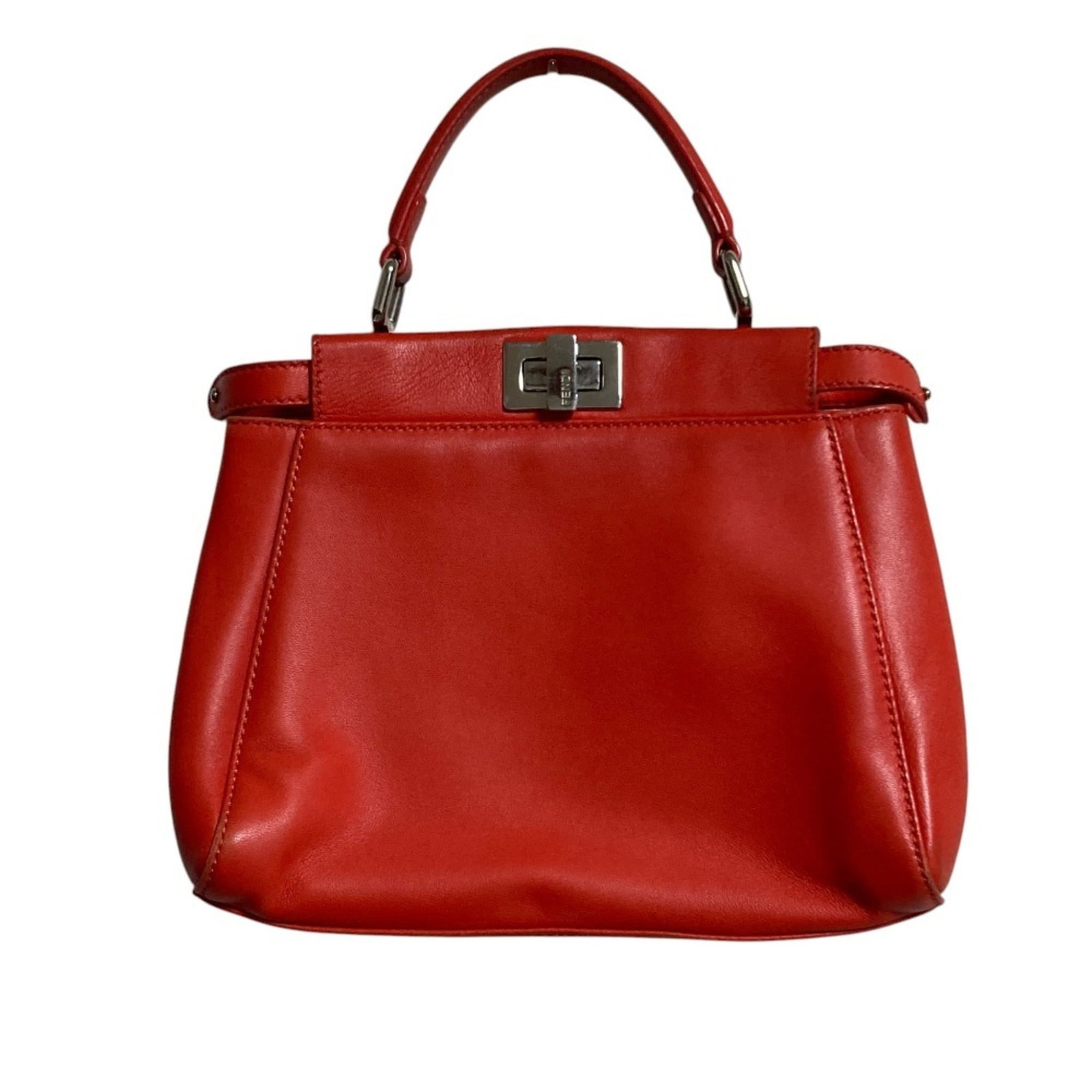 Fendi Handbag Leather: Fendi Handbag Leather Fendi Handbag Leather is made from high-quality leather, available in the vibrant orange color. The handbag measures 19.5cm x 26cm x 7cm and features a distinctive design. This