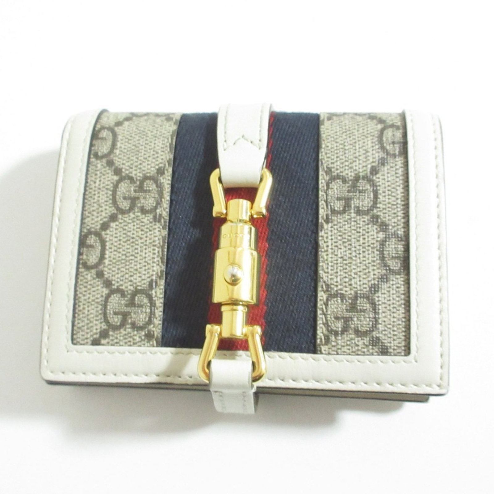 Gucci Bi Fold Wallet: Gucci Bi Fold Wallet Gucci Bi Fold Wallet features a sleek, grayish and white design with clean lines. This bi-fold wallet measures 8.5cm x 11cm x 3cm, making it a compact and stylish accessory for