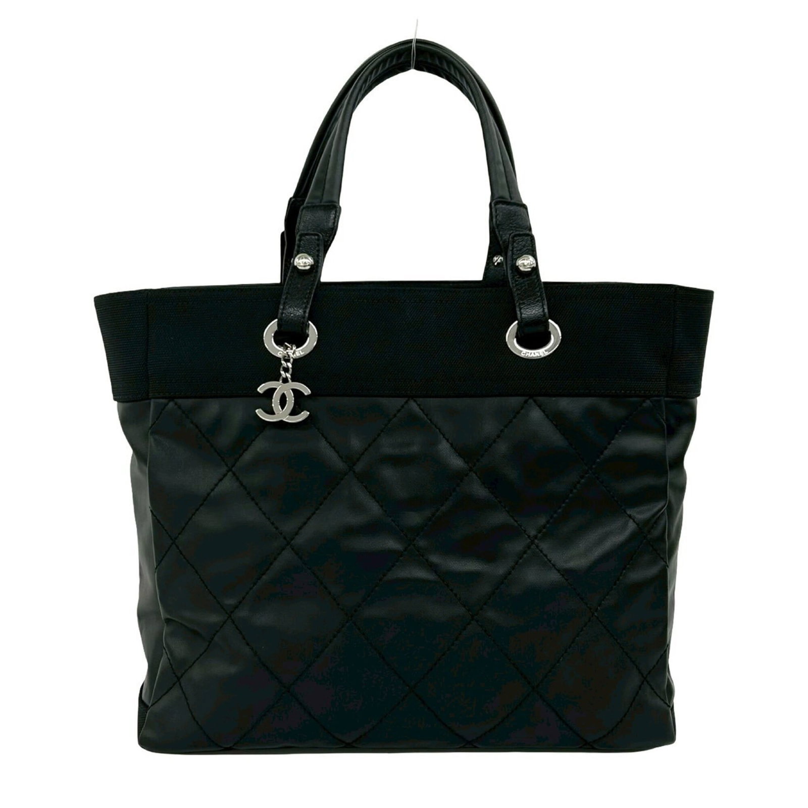 Canvas leather tote bag by Chanel: Canvas leather tote bag by Chanel Canvas leather tote bag by Chanel, featuring a sleek black design with a durable canvas and high-quality leather construction. Measuring 30cm x 34cm x 15cm, this