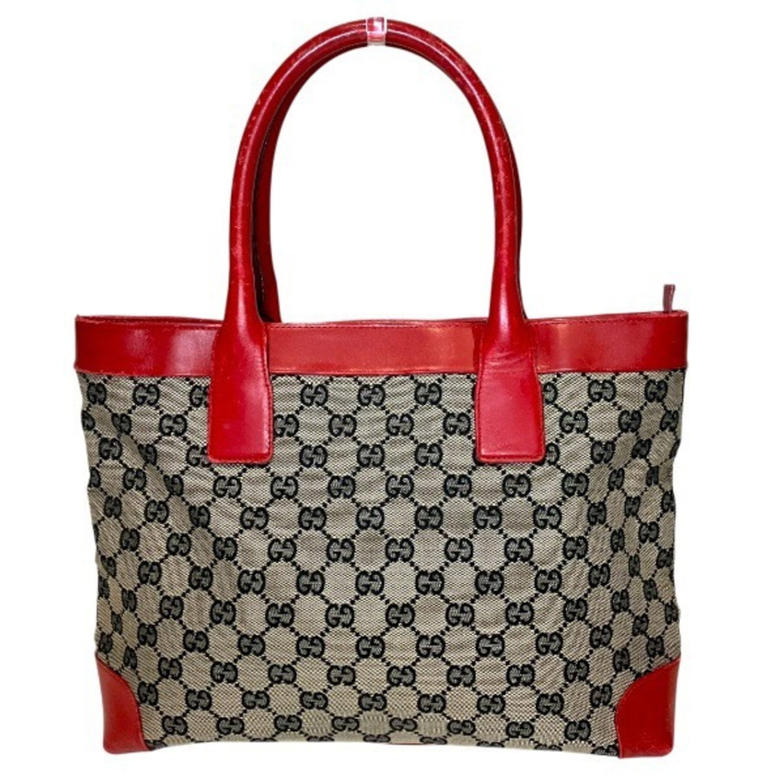 Canvas tote bag handbag Gucci: Canvas tote bag handbag Gucci Gucci's iconic GG canvas tote bag boasts a timeless design, featuring the signature interlocking Gs in beige and red hues. Made from high-quality GG canvas material, this