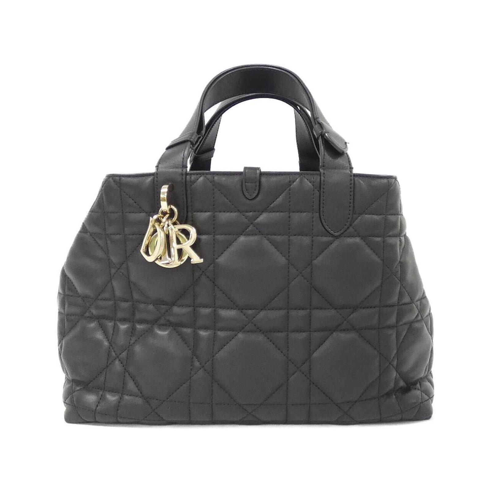 Handbag Christian Dior Leather: Handbag Christian Dior Leather Christian Dior's iconic handbag boasts sleek black leather and gold hardware, exuding timeless sophistication. Crafted from high-quality calfskin, the bag features a