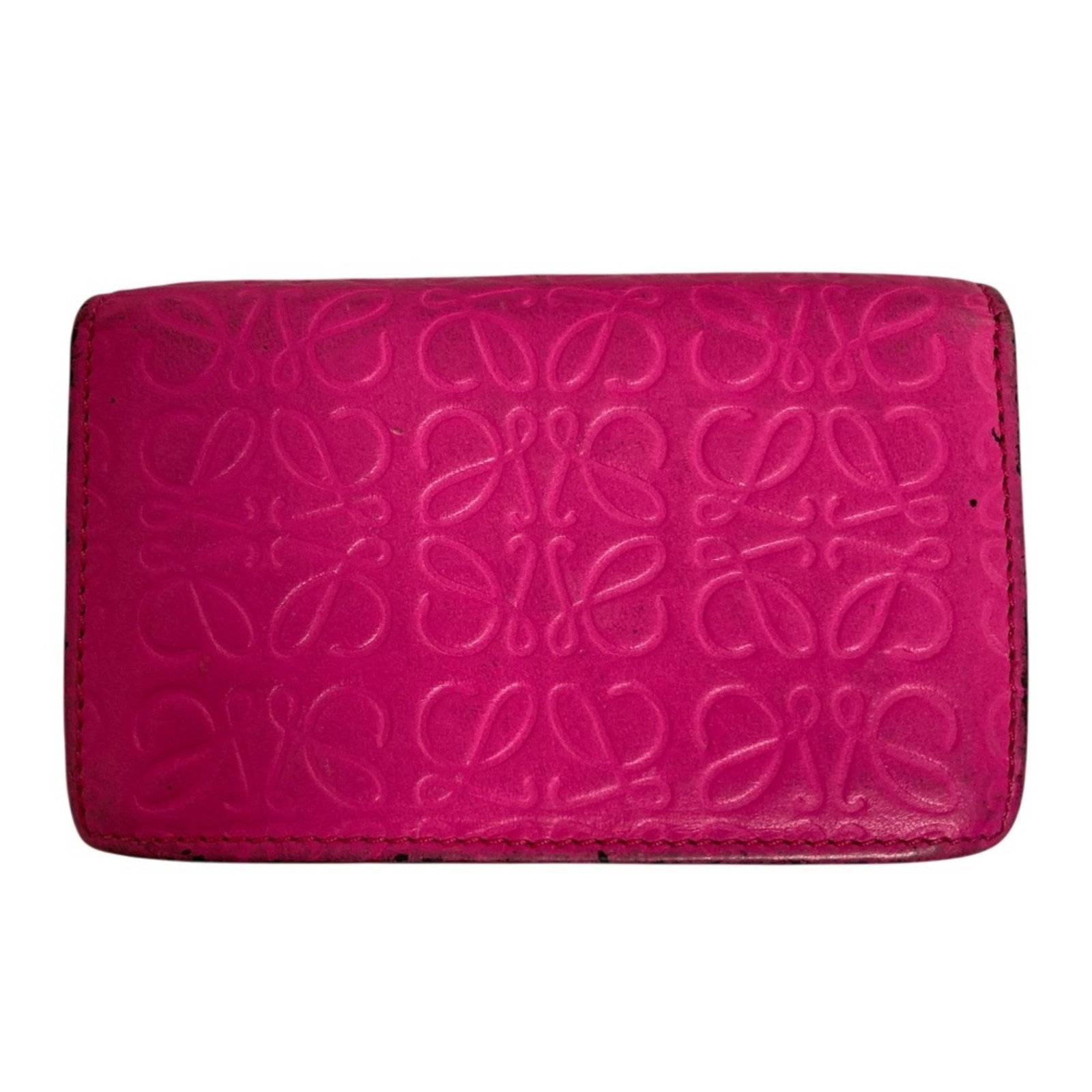 Business Card Case By Loewe: Business Card Case By Loewe Pink Business Card Case by Loewe. A compact, elegant case measuring 7cm x 10.5cm x 1.5cm, perfect for holding a few essential cards. The soft pink hue adds a touch of femin