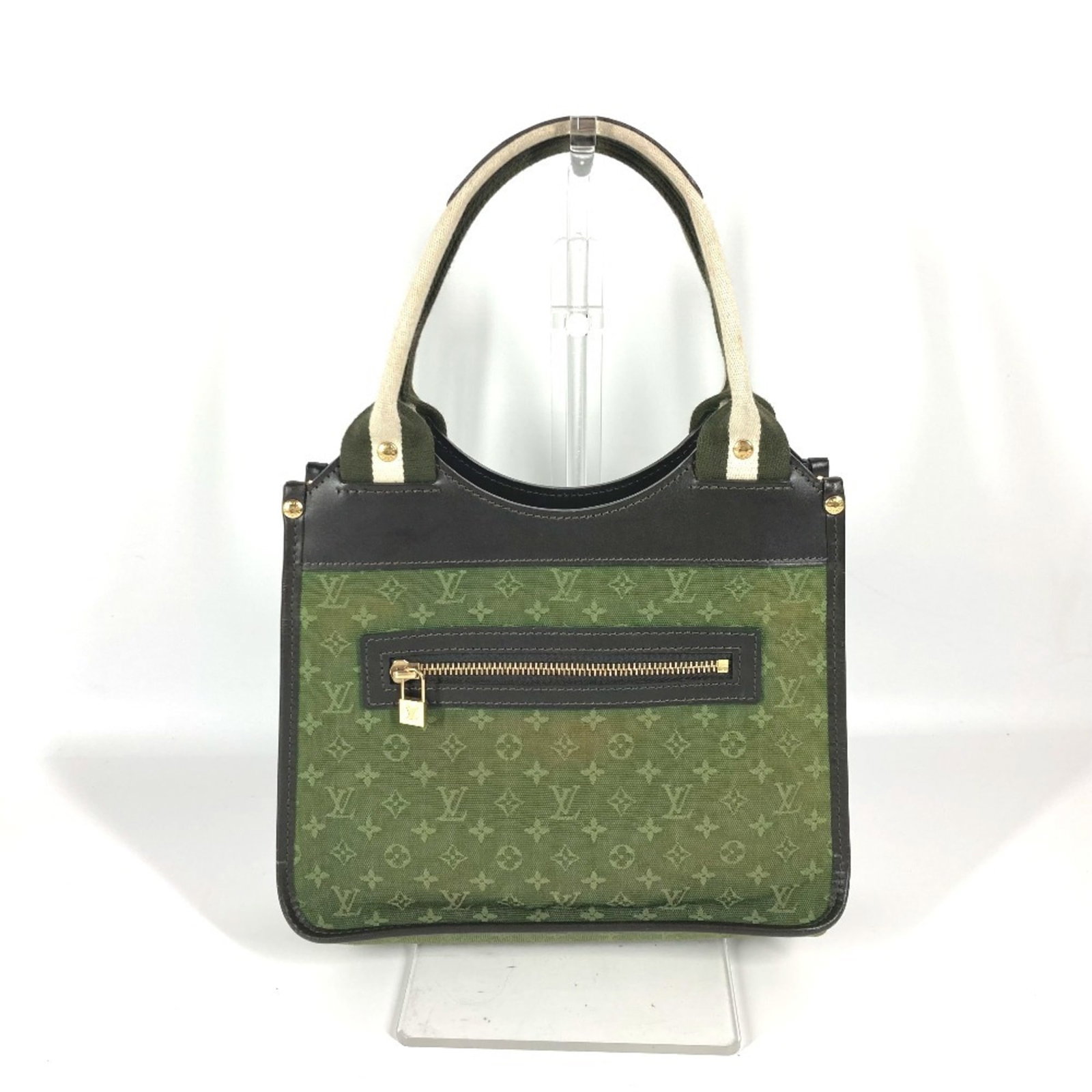 Vuitton Handbag Louis Tote Monogram Mini: Vuitton Handbag Louis Tote Monogram Mini The Louis Tote Monogram Mini from Louis Vuitton is a compact and stylish tote bag featuring the iconic monogram pattern in khaki. Measuring just 18.5cm x 23.5c