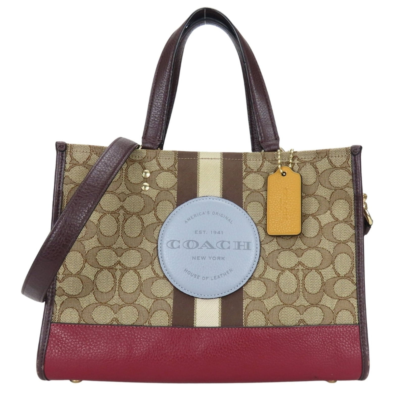 Canvas Leather Coach Tote Bag: Canvas Leather Coach Tote Bag Canvas Leather Coach Tote Bag - A timeless Bordeaux brown tote with canvas and leather construction, bearing the iconic Coach signature. Measuring 21.5cm x 29cm x 13cm, t