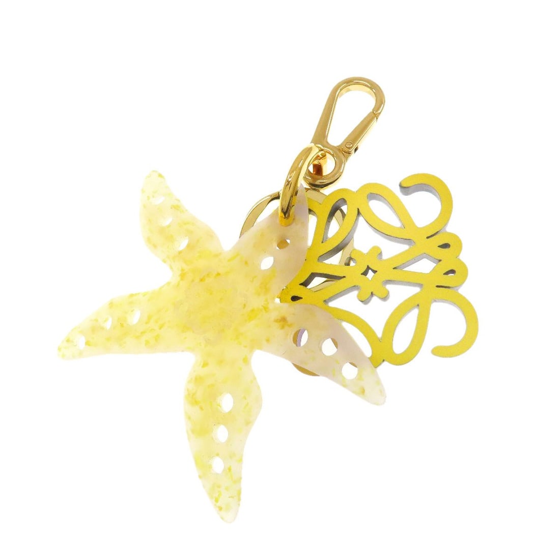 Leather Paula'S Starfish Anagram Key Loewe Ring Ibiza: Leather Paula'S Starfish Anagram Key Loewe Ring Ibiza Yellow leather key ring from LOEWE, featuring the iconic Paula's Starfish design. This unique accessory showcases the brand's signature style