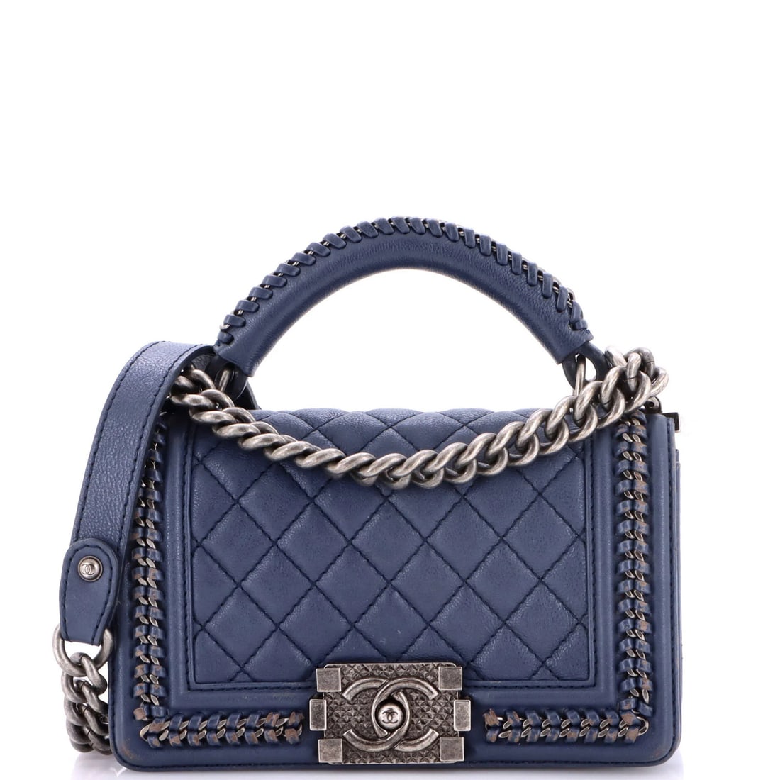 Small quilted calfskin flap bag chain handle boy by Chanel: Small quilted calfskin flap bag chain handle boy by Chanel Chain handle boy flap bag with quilted calfskin exterior in blue, featuring a classic Chanel design. Measuring small at 5" height and 8"
