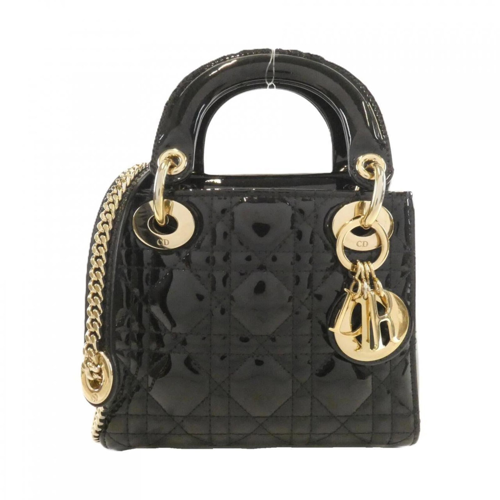 Handbag by Christian Dior: Handbag by Christian Dior Black luxury meets timeless elegance in this sleek Christian Dior handbag, featuring gold hardware and a sophisticated design. Measuring just 5.51'' x 6.69'' x 2.75'', it's
