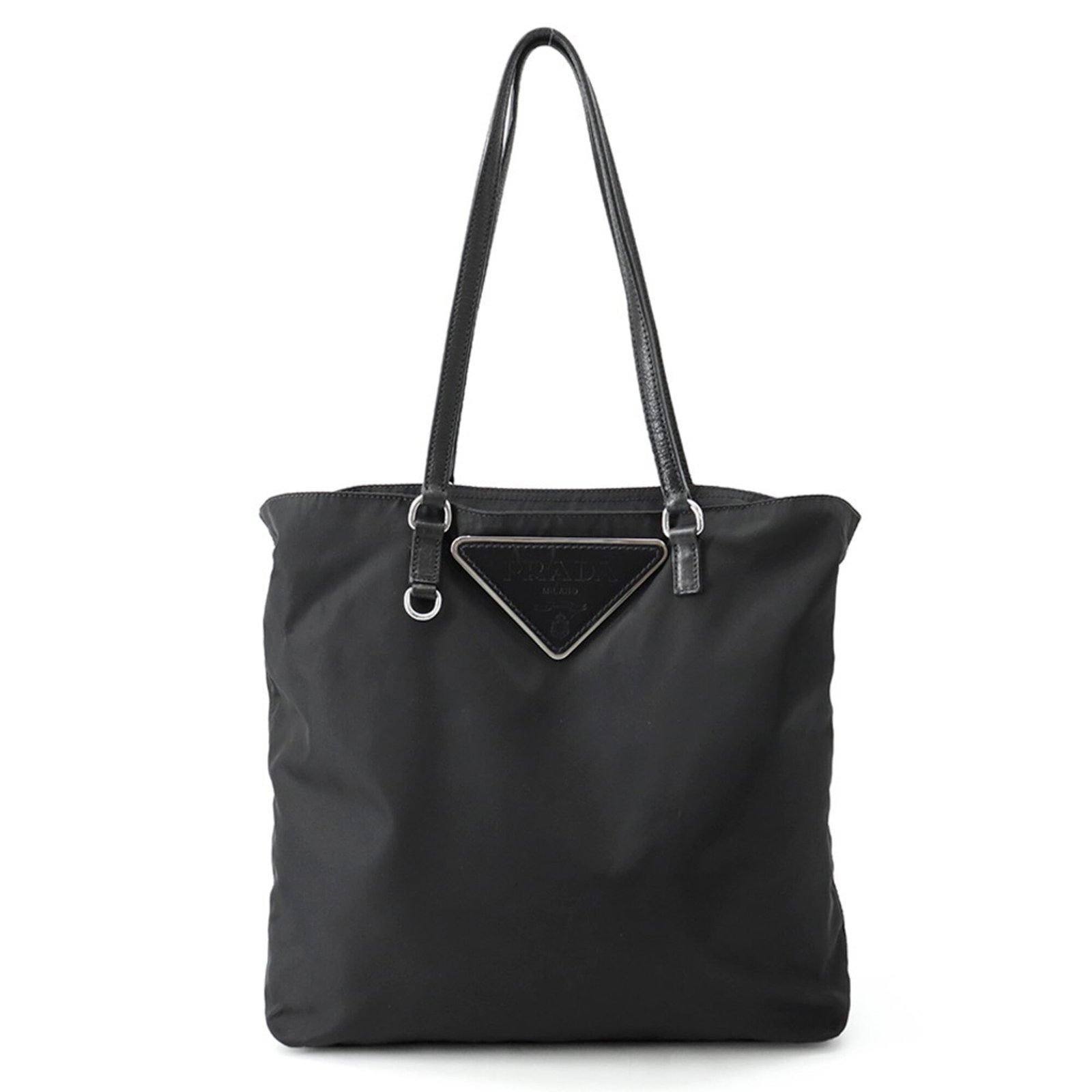 Nylon Leather Prada Handbag Tote: Nylon Leather Prada Handbag Tote Nylon and leather combine in this sleek, black Prada tote bag from Italy. The silver hardware adds a touch of sophistication to the overall design, while the nylon and
