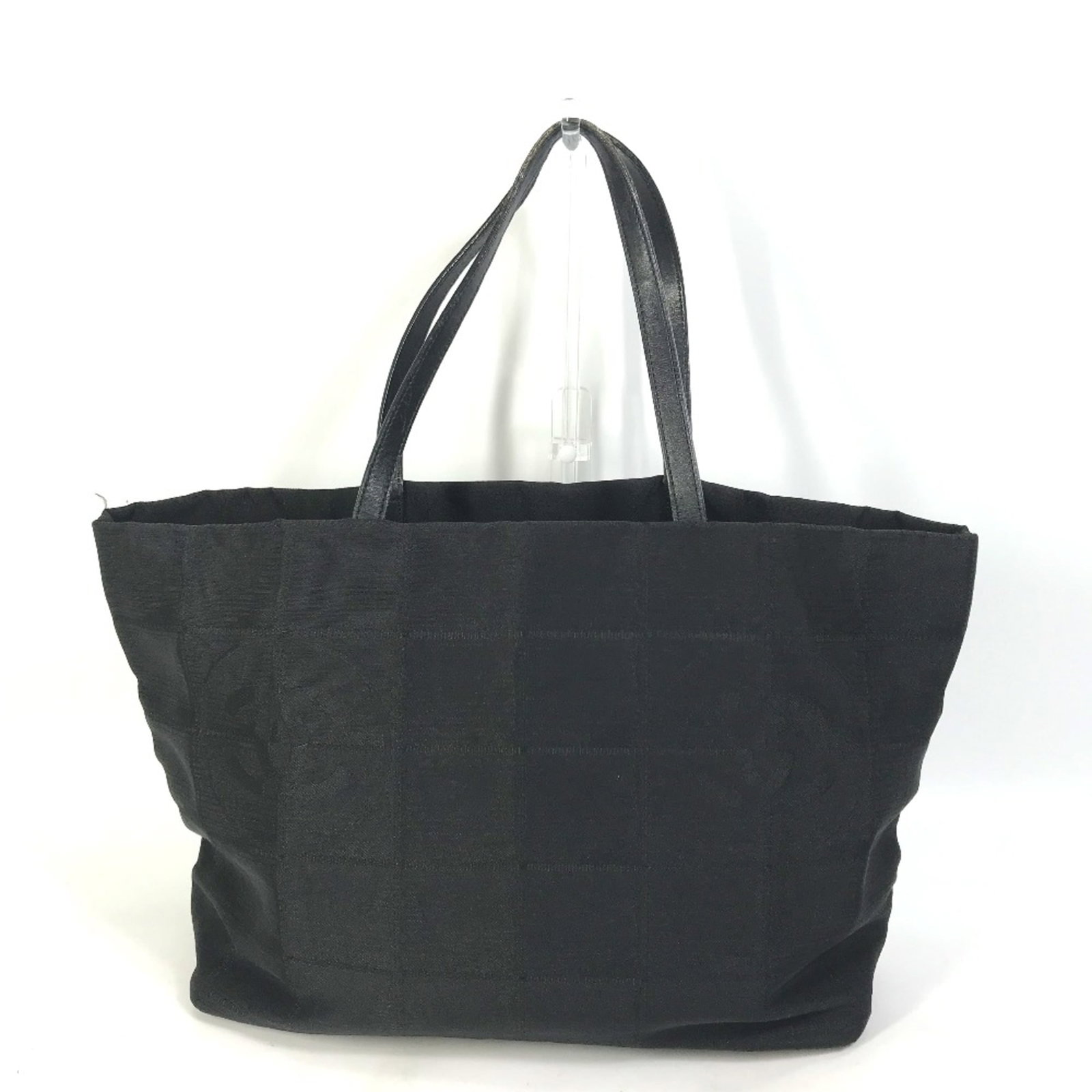 Tote Bag by Chanel: Tote Bag by Chanel Black Chanel tote bag with dimensions W34.5cmxH28cmxD15cm/W13.6xH11.0xD5.9inch and serial number 1300****. This tote features a classic design from the renowned fashion brand, Chane