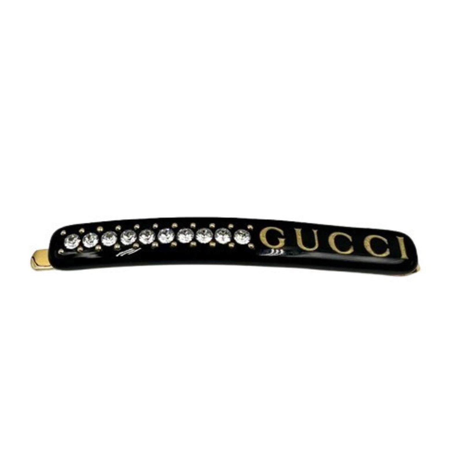 Gucci resin hair pin: Gucci resin hair pin Resin hair pin from Gucci, featuring a crystal stone and measuring 8mm x 6cm. The black resin material gives the piece its sleek and modern appearance. The signature bears no