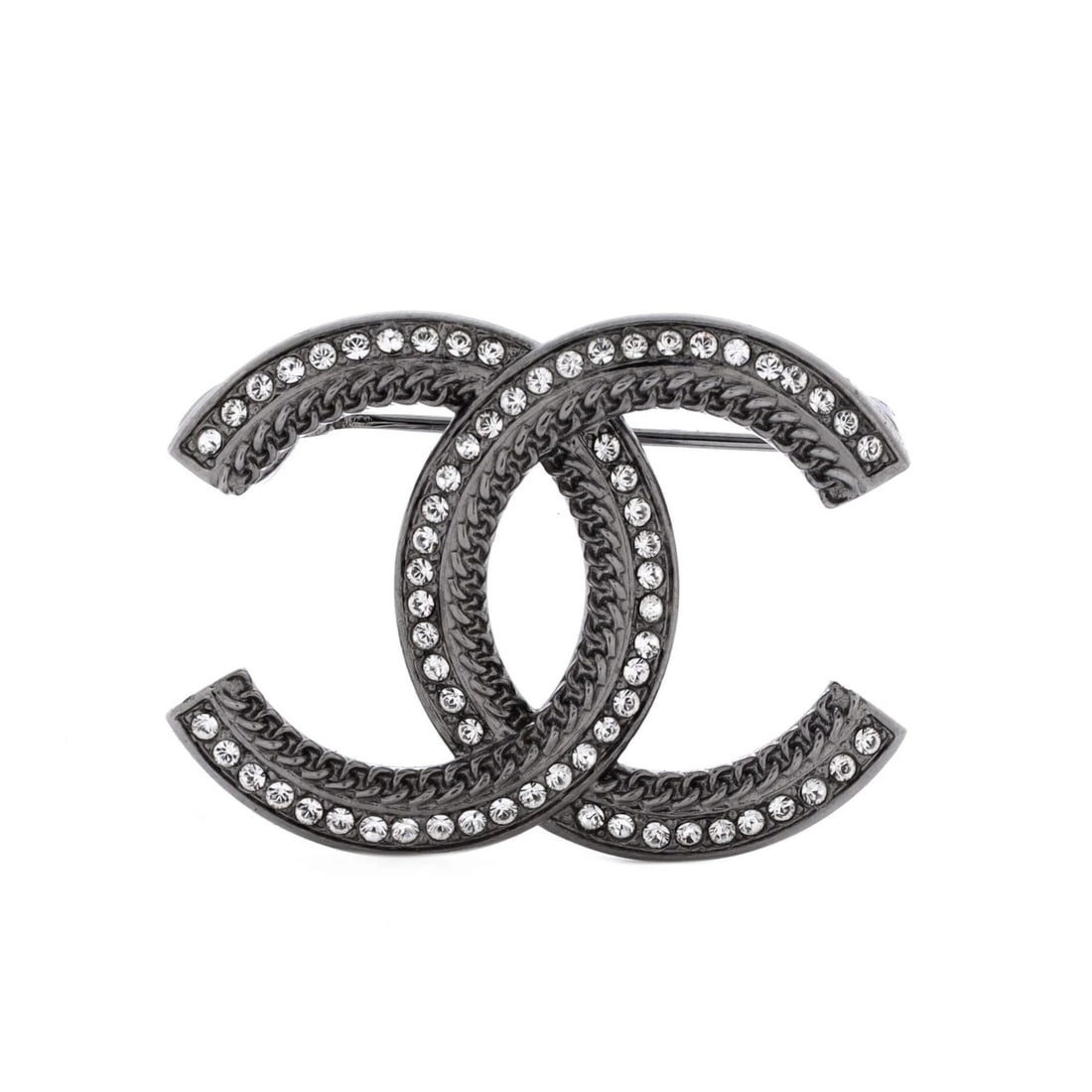 Chanel CC Brooch Metal with Crystals: Chanel CC Brooch Metal with Crystals The Chanel CC Brooch Metal with Crystals boasts an elegant silver finish and intricate crystal details, adding a touch of sophistication to any outfit. Measuring