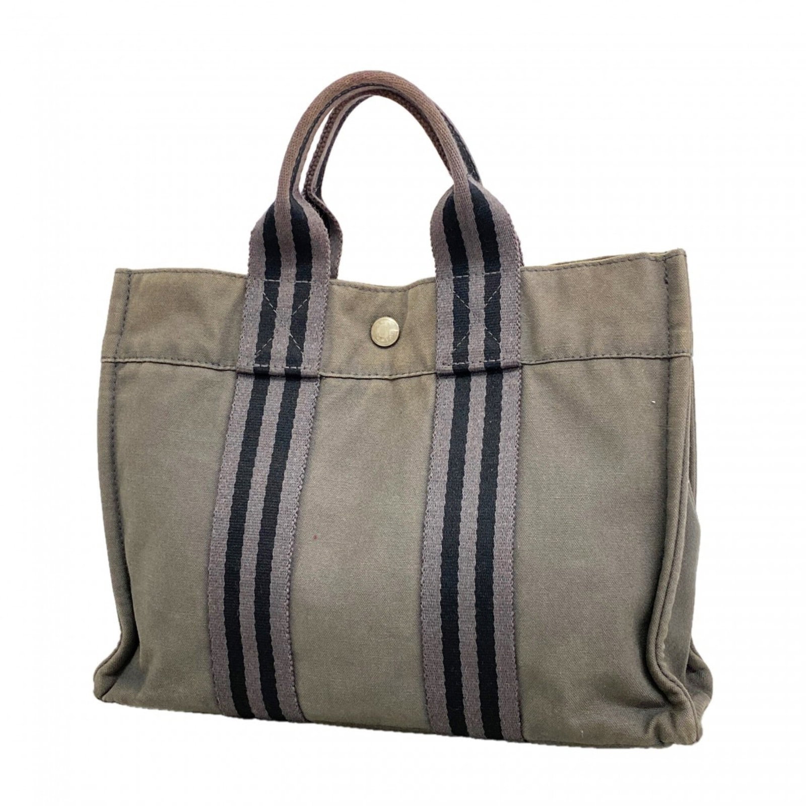 Canvas Hermes Tote Bag: Canvas Hermes Tote Bag Canvas tote bag from Hermes, made from high-quality canvas material in a versatile gray color. The silver hardware adds a touch of sophistication to this classic design, measuri