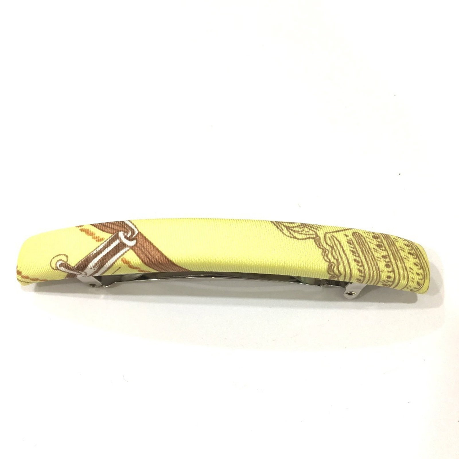 Hermes barrette silk: Hermes barrette silk Yellow silk barrette from Hermes, measuring 1.5cm x 1.5cm and packaged in a box and dust bag. This small accessory showcases the brand's attention to detail and craftsmanship. A b