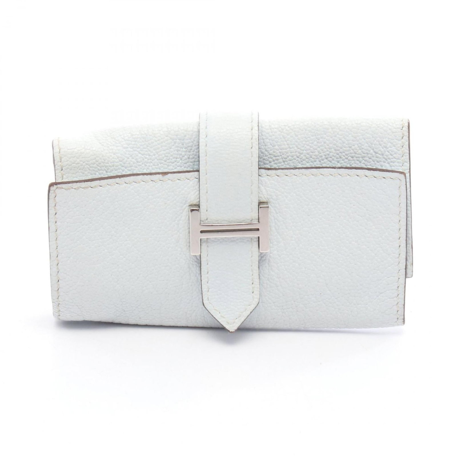 Chevre Leather Keycase By Hermes: Chevre Leather Keycase By Hermes Chevre leather, a unique and luxurious material, adorns this compact keycase by Hermes. The soft blue hue adds a touch of elegance to its sleek design, making it a sty