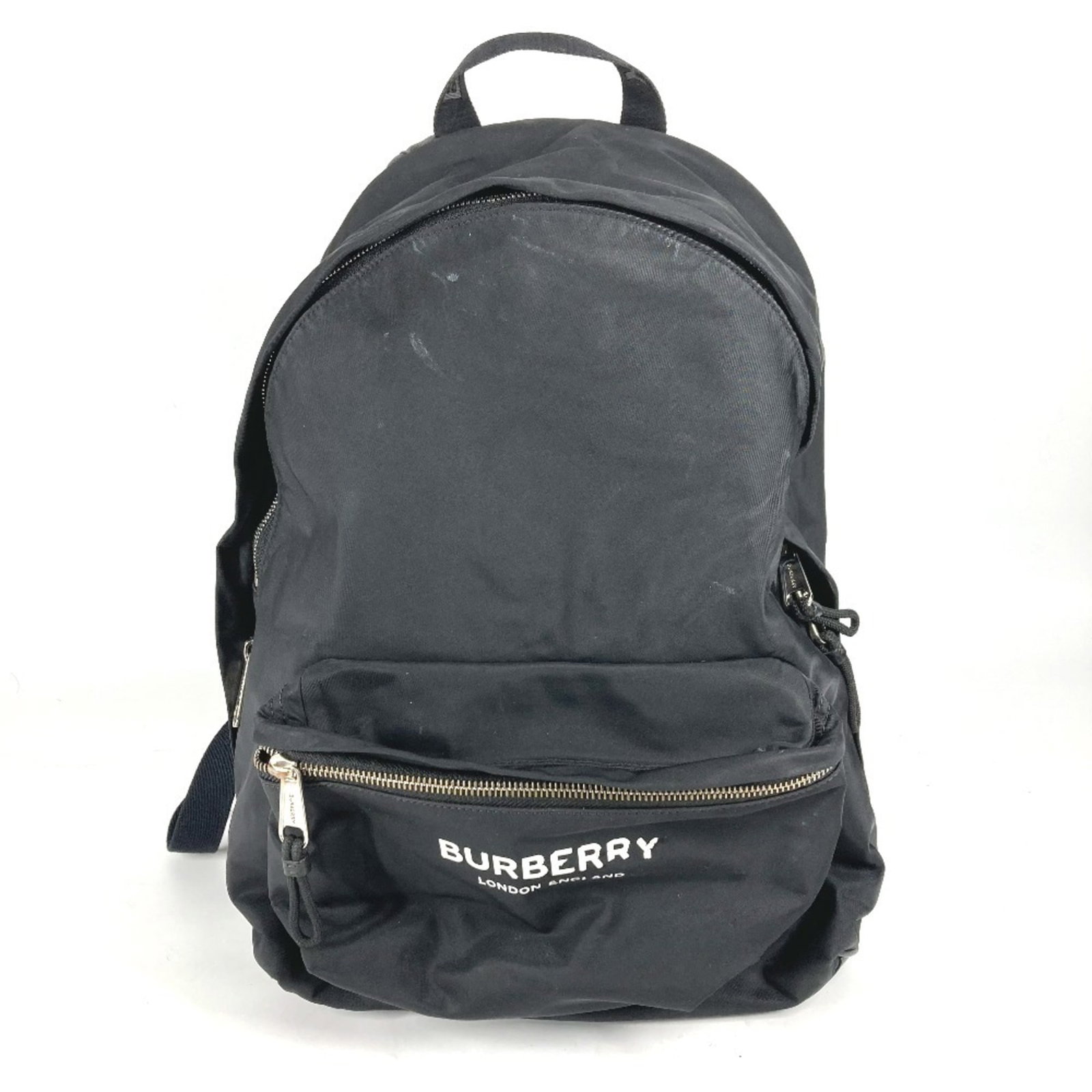Nylon Backpack Burberry: Nylon Backpack Burberry Nylon Backpack from Burberry, featuring a classic Bicolor design with black and white accents. This versatile backpack boasts a sleek zipper closure and two convenient pockets 