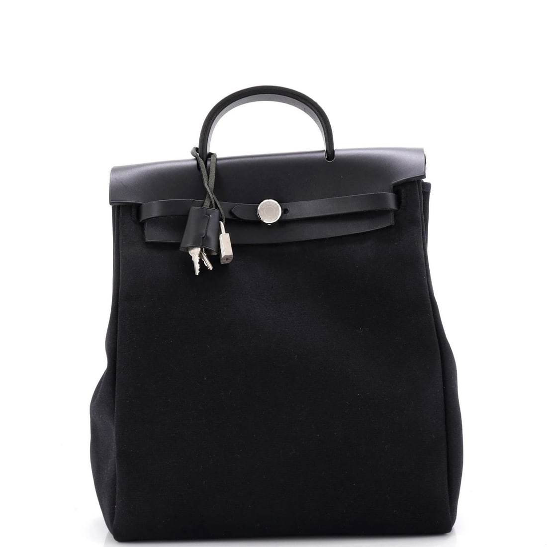 Herbag Dos Backpack Toile To: Herbag Dos Backpack Toile To Black leather and canvas backpack with clochette keys, measuring 13" drop handle, 11" width, and 4" depth. This Herbag A Dos Backpack Toile features a classic design with 