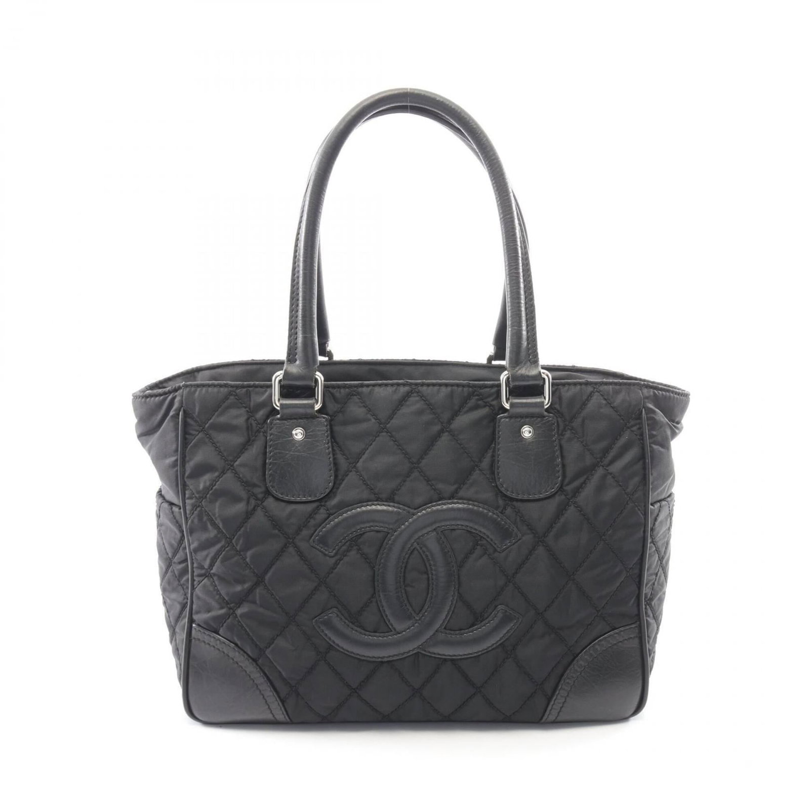 Chanel Handbag Tote Bag Nylon Leather: Chanel Handbag Tote Bag Nylon Leather Chanel's iconic tote bag features a sleek black design, combining nylon and leather materials for a durable and stylish look. Measuring 26cm x 33cm x 14cm, it off