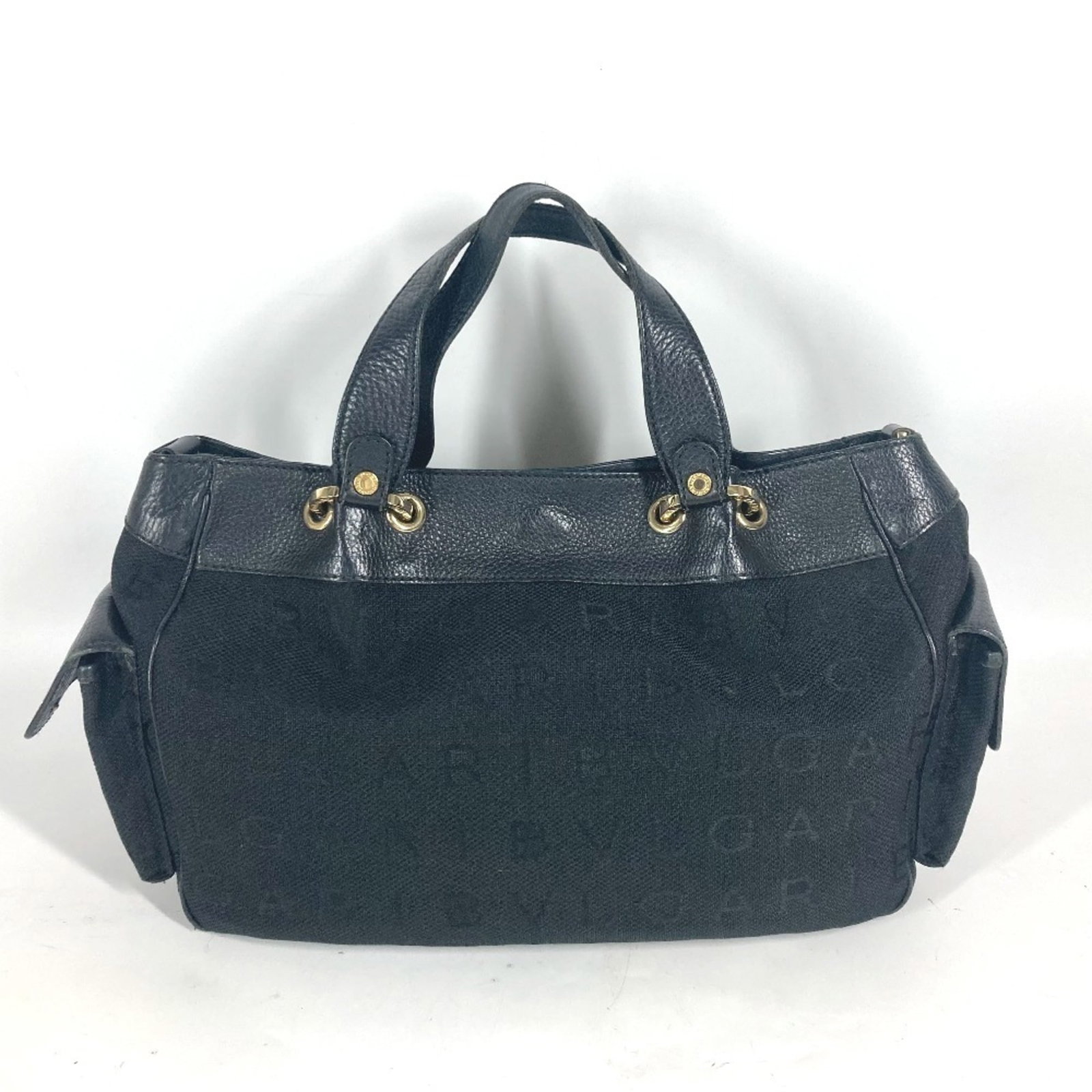 Bag Canvas Leather Shoulder Tote Bvlgari: Bag Canvas Leather Shoulder Tote Bvlgari Canvas and leather blend in sleek black, defining the shape of this shoulder tote from Bvlgari. The bag's canvas and leather construction provides a sturdy