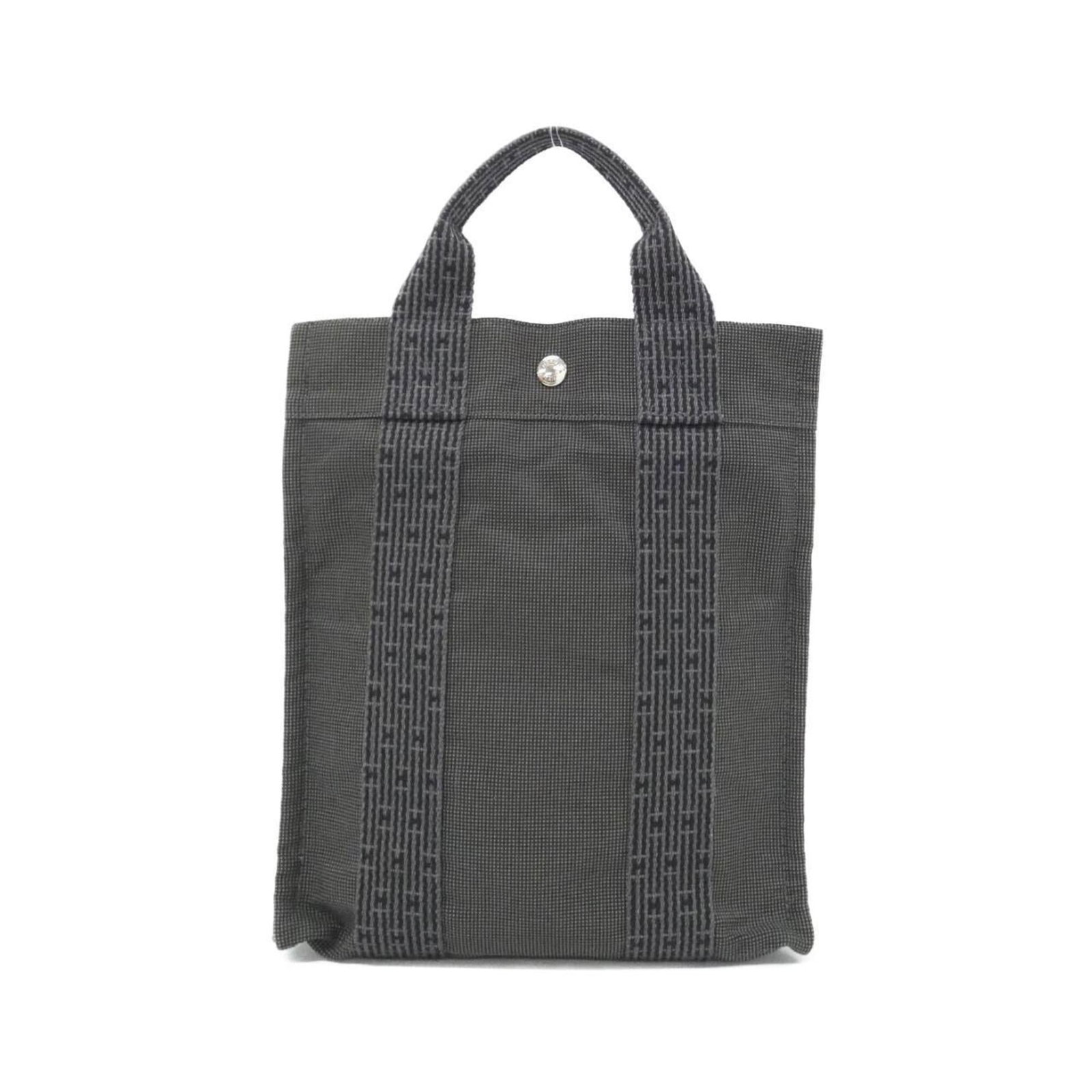 Canvas Backpack by Hermes: Canvas Backpack by Hermes Canvas Backpack by Hermes. This black canvas backpack features a classic design with clean lines and minimal ornamentation, making it a timeless piece for everyday use. Its
