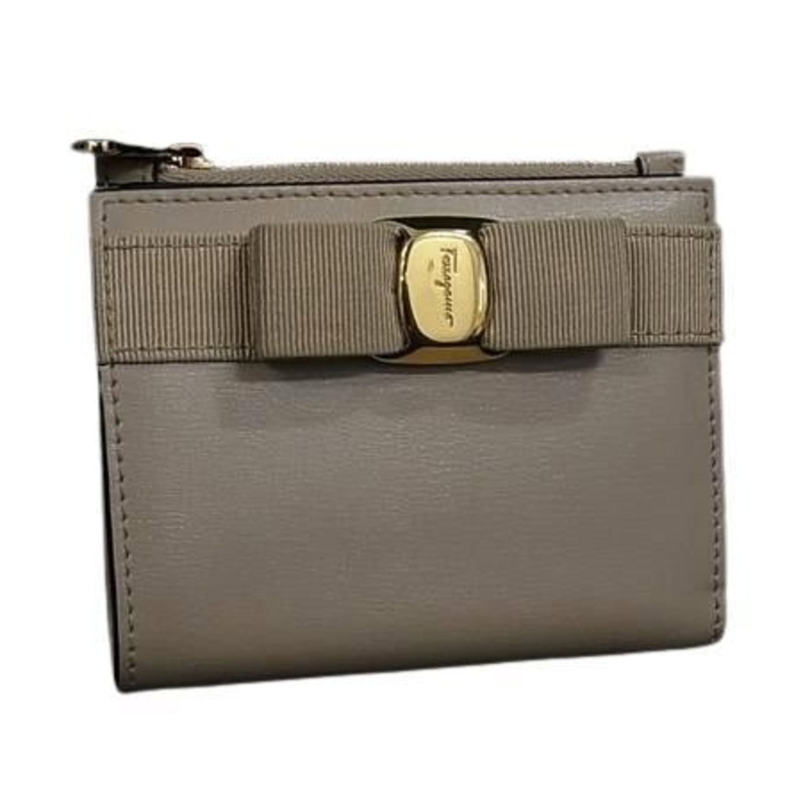 Salvatore Ferragamo Wallet (Bi-Fold) Leather: Salvatore Ferragamo Wallet (Bi-Fold) Leather Salvatore Ferragamo's jp-22-e009 bi-fold wallet boasts classic elegance with its beige leather design, measuring 9cm x 11.5cm x 2.7cm in size. The wallet