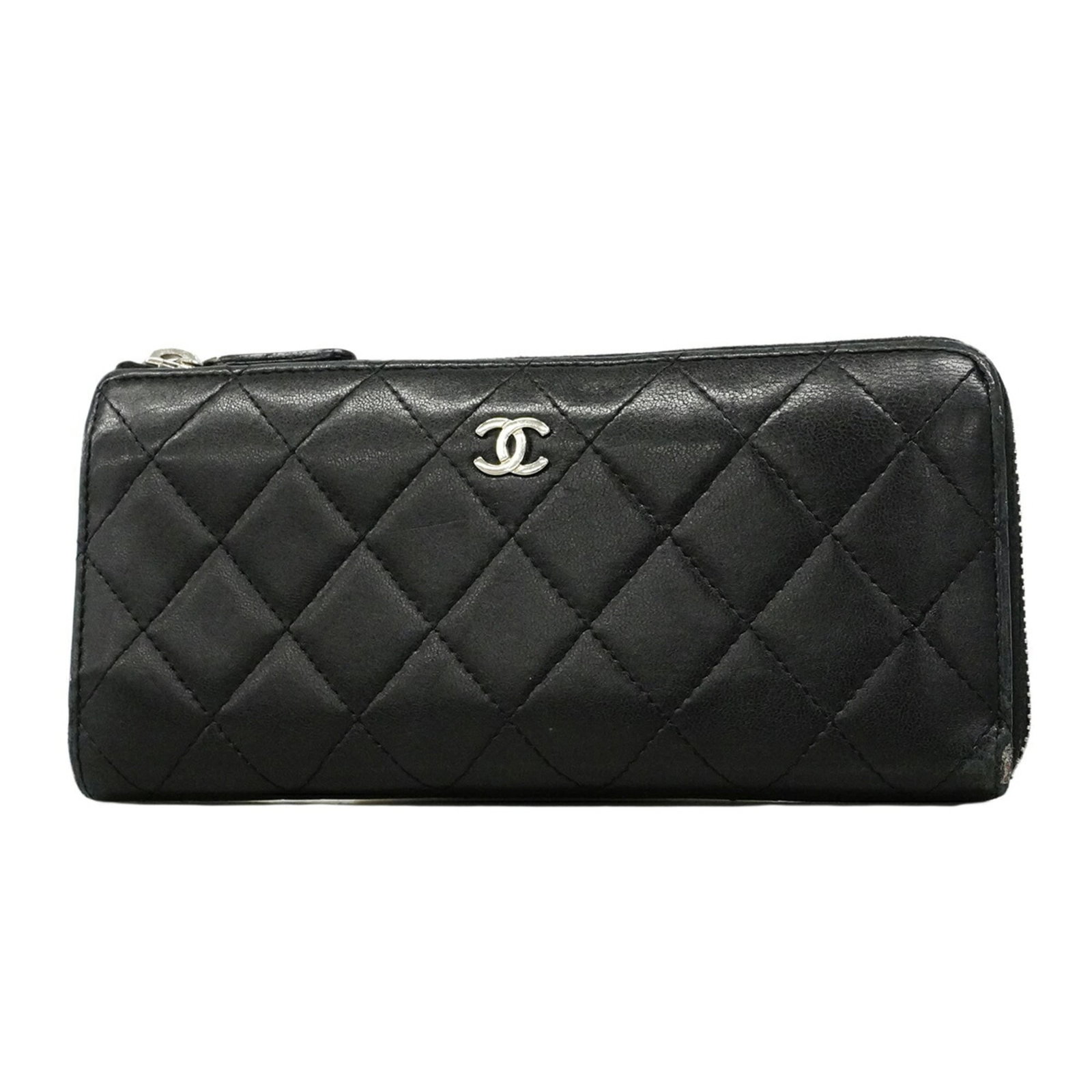 Chanel Long Wallet (Bi-Fold) Leather: Chanel Long Wallet (Bi-Fold) Leather Chanel's iconic long wallet in black lambskin leather boasts a sleek bi-fold design, perfect for everyday carry. Measuring just 9cm x 19.5cm x 2.5cm, it fits